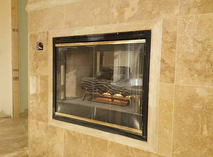 This custom indoor fireplace renovation by Reno Compass features a built-in gas fireplace with a natural stone tile surround, creating a warm and elegant focal point for the home. Carefully installed with precise framing and finishing, the fireplace enhances both comfort and interior aesthetics. As a trusted Toronto renovation contractor, Reno Compass delivers professional fireplace installations and interior upgrades with high-quality materials, clean workmanship, and modern design tailored to GTA homes.