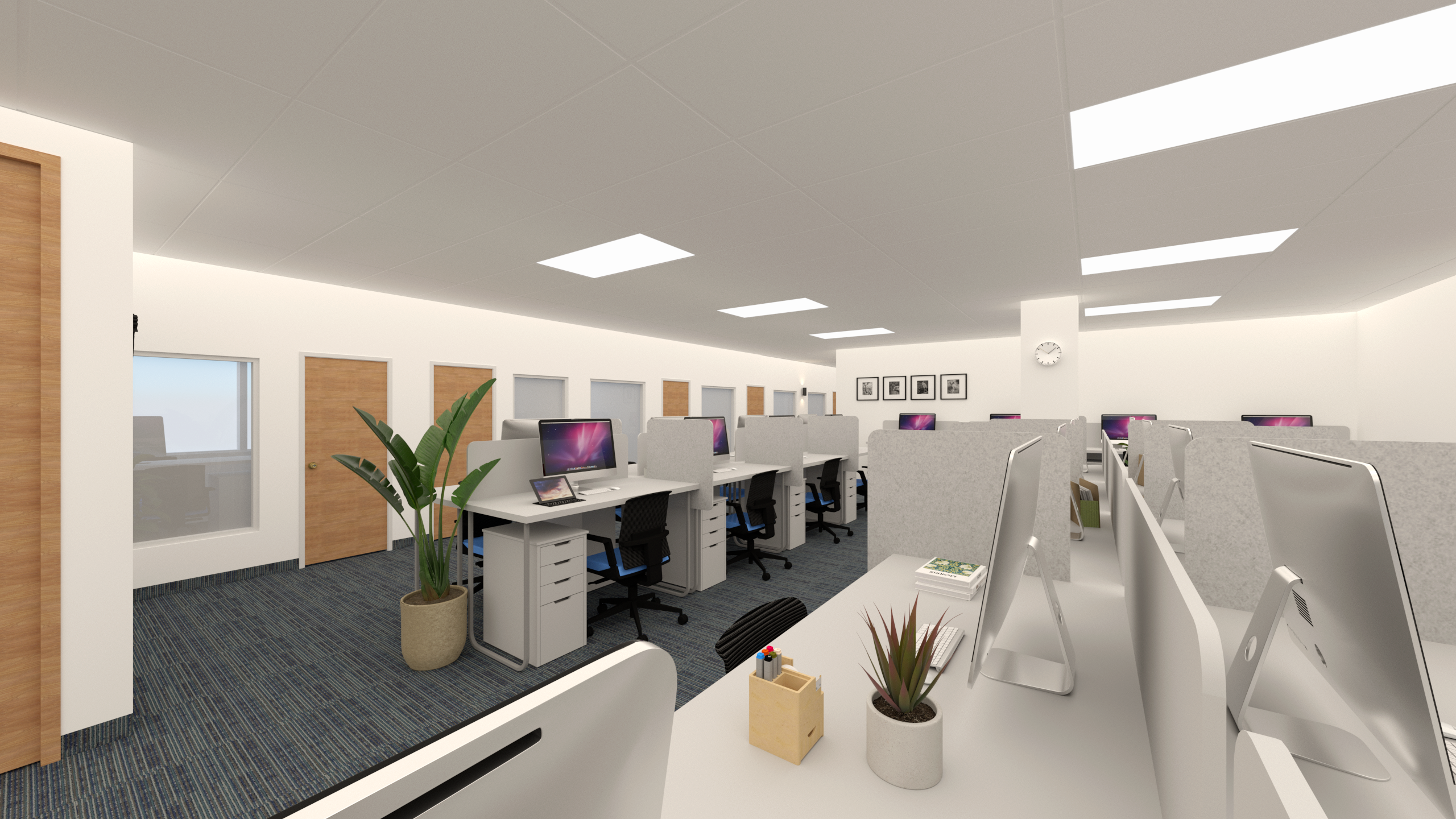 This image presents the renovated open office area of an ICBC Toronto branch, designed to support efficient daily operations and a structured working environment. The layout features modular workstations, clean-lined office desks, neutral-toned finishes, and integrated overhead lighting to ensure visual comfort and functionality. Wood doors, glass panels, and soft carpet flooring enhance acoustic control and spatial order, reflecting contemporary commercial office renovation standards for financial institutions in Toronto.
