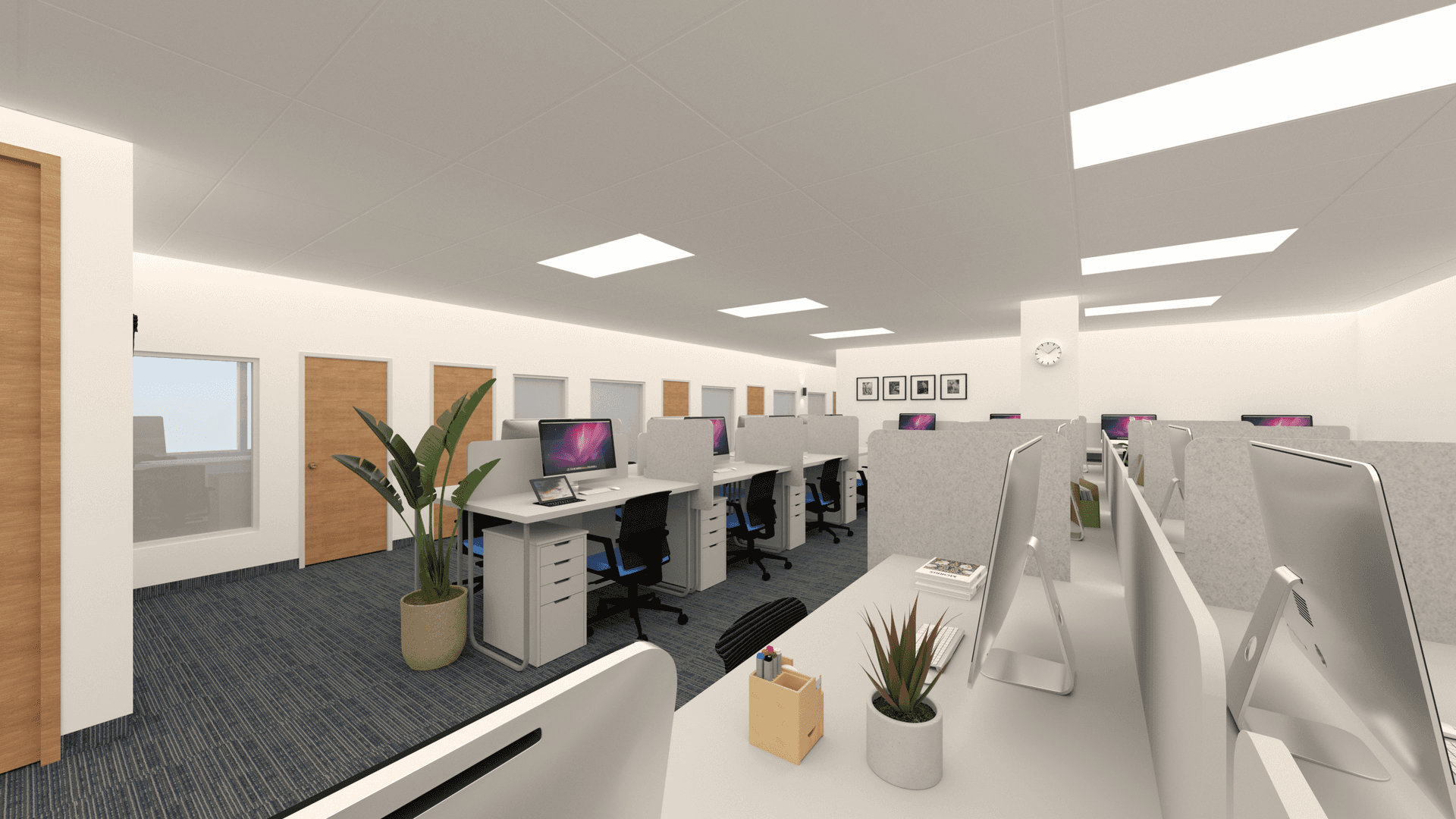 This image presents the renovated open office area of an ICBC Toronto branch, designed to support efficient daily operations and a structured working environment. The layout features modular workstations, clean-lined office desks, neutral-toned finishes, and integrated overhead lighting to ensure visual comfort and functionality. Wood doors, glass panels, and soft carpet flooring enhance acoustic control and spatial order, reflecting contemporary commercial office renovation standards for financial institutions in Toronto.