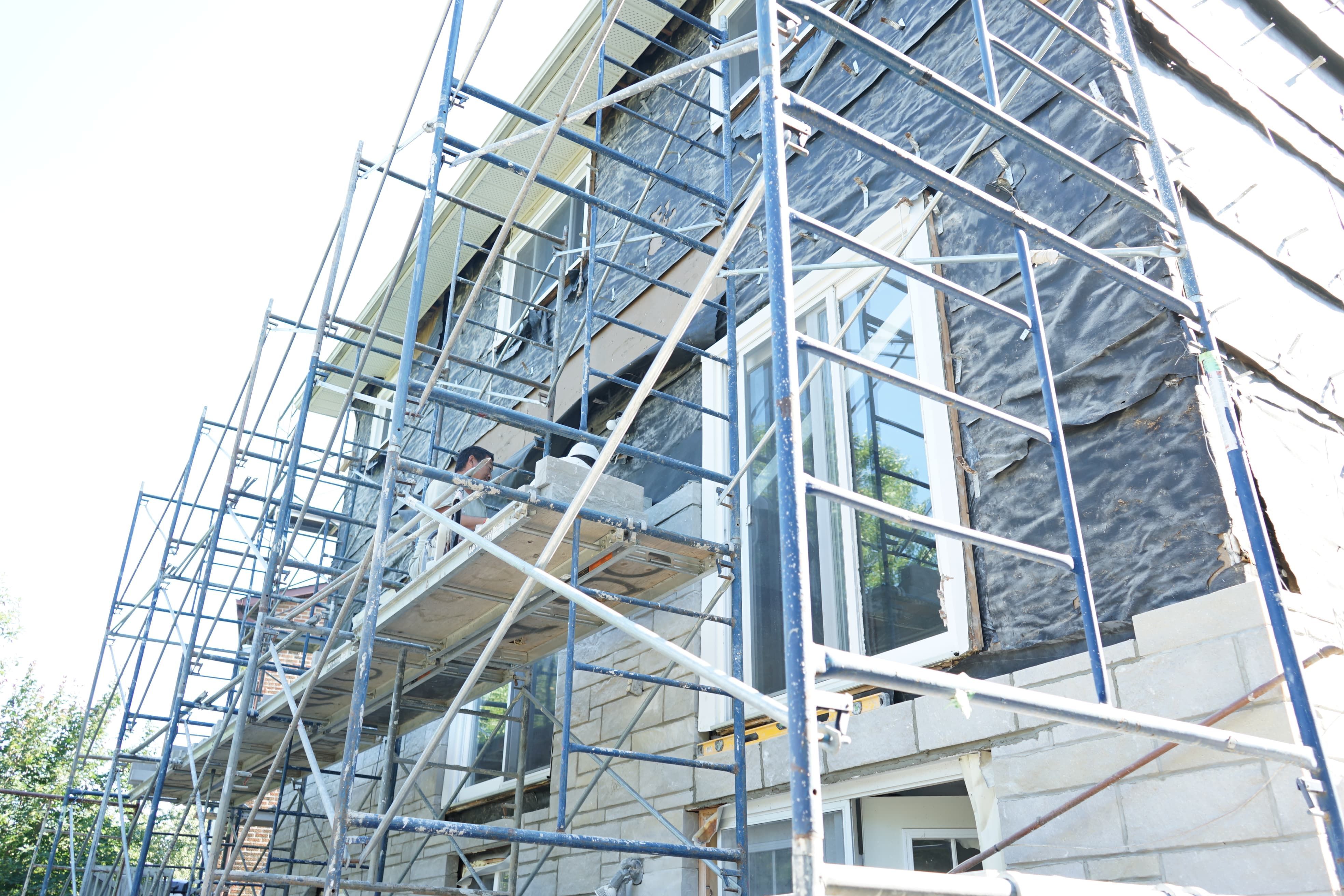 Professional exterior wall remodeling project in Richmond Hill showcasing a refreshed brick façade using high-quality finishes.