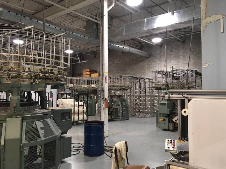 This Toronto factory renovation highlights a large-scale industrial interior upgrade designed to improve workflow, safety, and production efficiency. The project showcases an organized production floor with upgraded lighting, ventilation duct systems, and optimized machinery layout to support modern manufacturing operations. Completed by Reno Compass Inc., a trusted Toronto renovation company specializing in commercial and industrial projects, the renovation focuses on durable finishes, improved infrastructure, and a functional layout that enhances daily factory performance and long-term operational reliability.