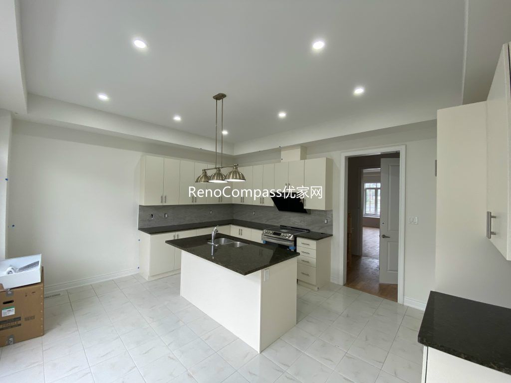 Custom-designed basement bar area renovation in Richmond Hill featuring a modern countertop, efficient lighting, and open-space layout. Reno Compass enhanced functionality and aesthetic appeal for entertainment use.