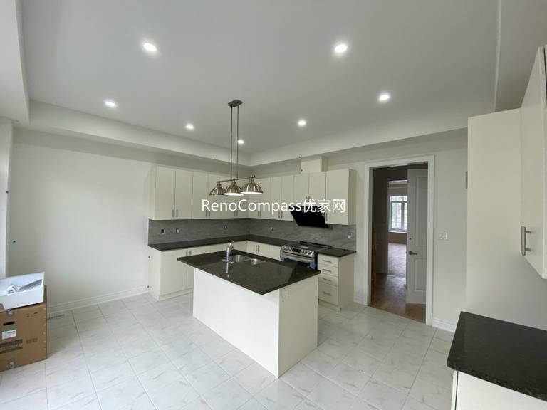 Custom-designed basement bar area renovation in Richmond Hill featuring a modern countertop, efficient lighting, and open-space layout. Reno Compass enhanced functionality and aesthetic appeal for entertainment use.