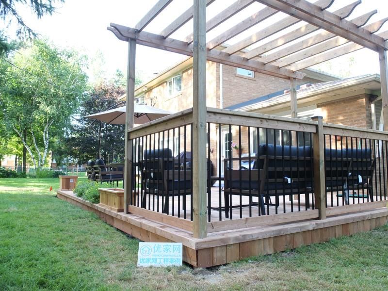 This Vaughan backyard deck project showcases a custom-built pressure-treated wood platform paired with a handcrafted pergola structure. The open-beam pergola design provides partial shade while maintaining airflow and natural light, creating a comfortable outdoor lounge environment.

The deck features black aluminum railings for safety and a modern contrast against the natural wood finish. With a spacious seating area and seamless transition from the home’s rear entrance, this deck enhances both functionality and visual appeal. Professionally constructed for durability, this outdoor upgrade significantly improves backyard usability and property value.