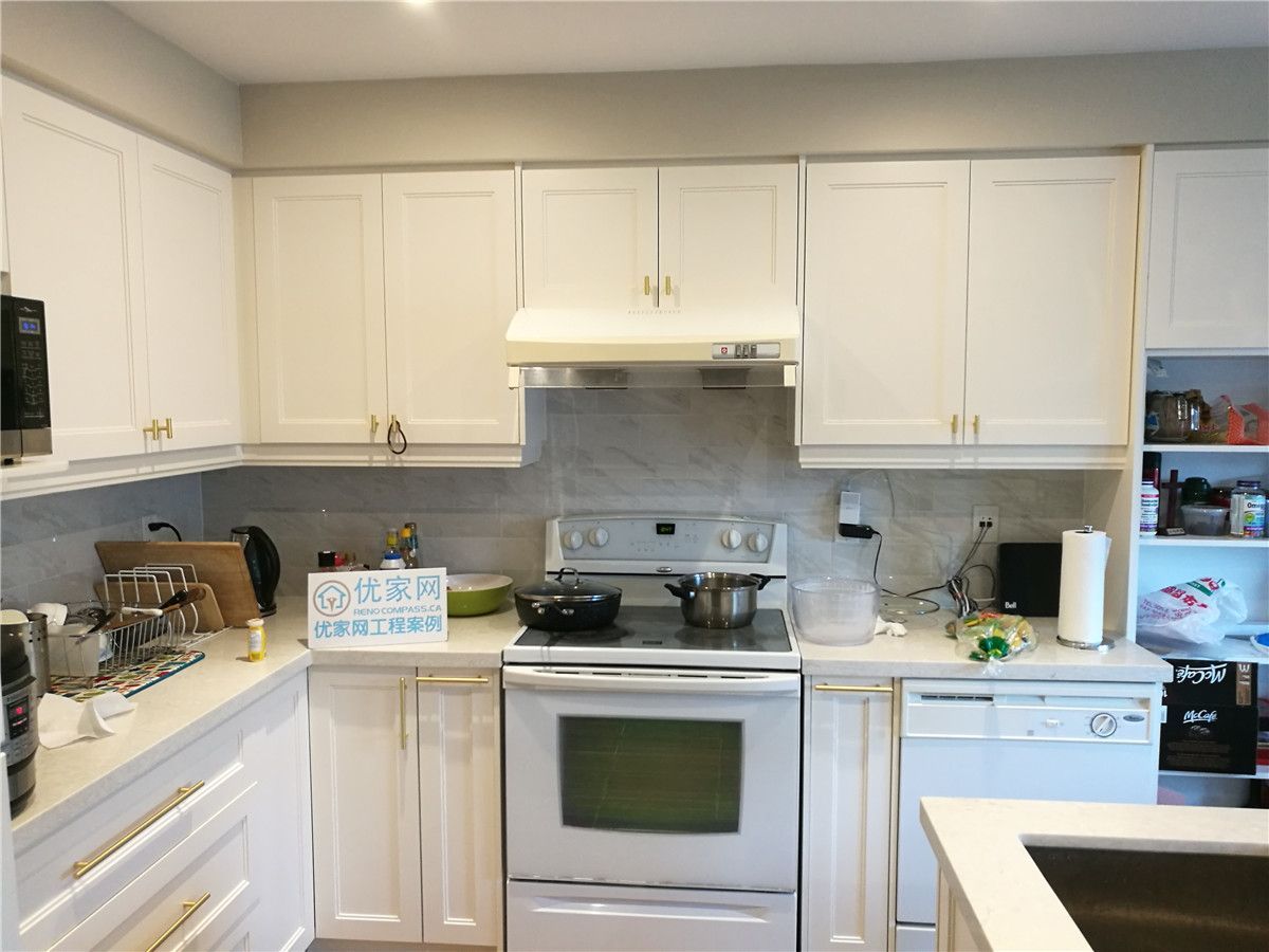 Contemporary kitchen renovation in Richmond Hill and Markham showcasing white cabinetry, quartz countertops, and upgraded lighting — a stylish transformation completed by Toronto renovation company Reno Compass Inc.