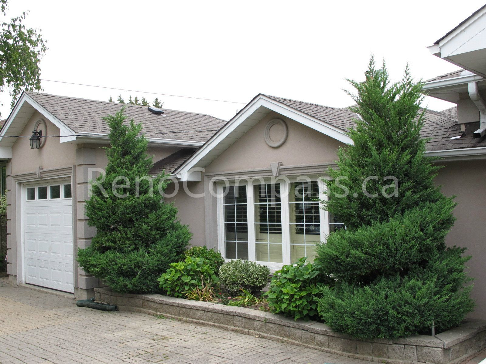 This image shows the exterior of a detached house undergoing a roofing renovation project in Vaughan, Greater Toronto Area. The roofing upgrade is designed to improve durability, weather resistance, and overall curb appeal. Completed by a professional Toronto Renovation Company, this roof renovation enhances both the protection and long-term value of the home.