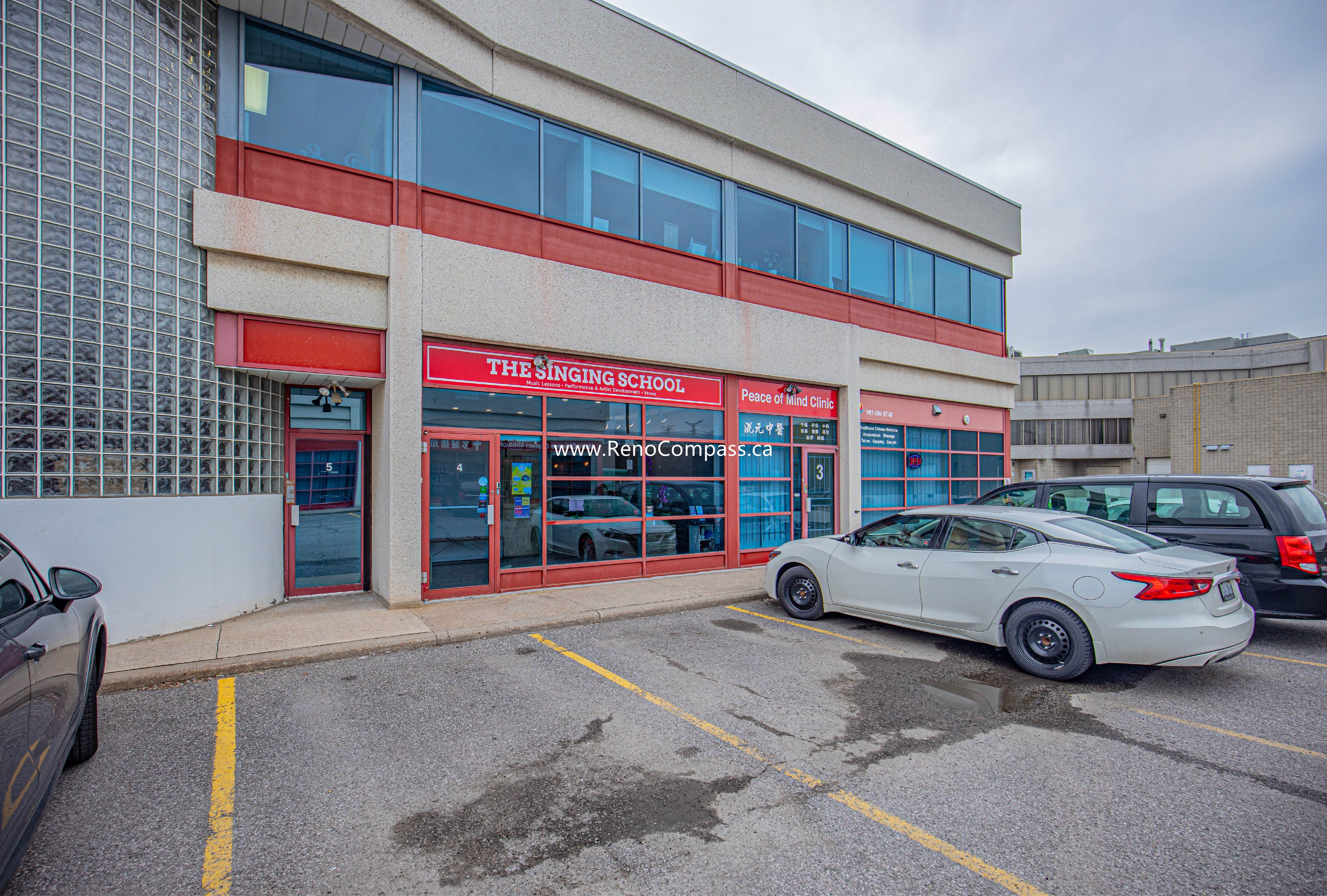 A professional exterior renovation of "The Singing School" in Richmond Hill. This project involved updating the facade, window framing, and entrance to create a modern, welcoming commercial space.
