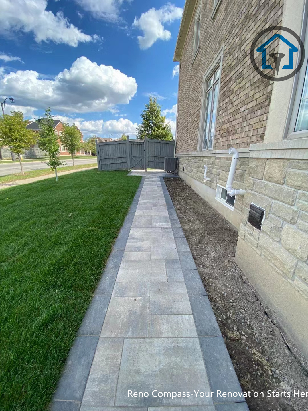 Custom interlocking walkway renovation in Vaughan, creating a clear and elegant entrance path with precise stone alignment and strong visual balance.