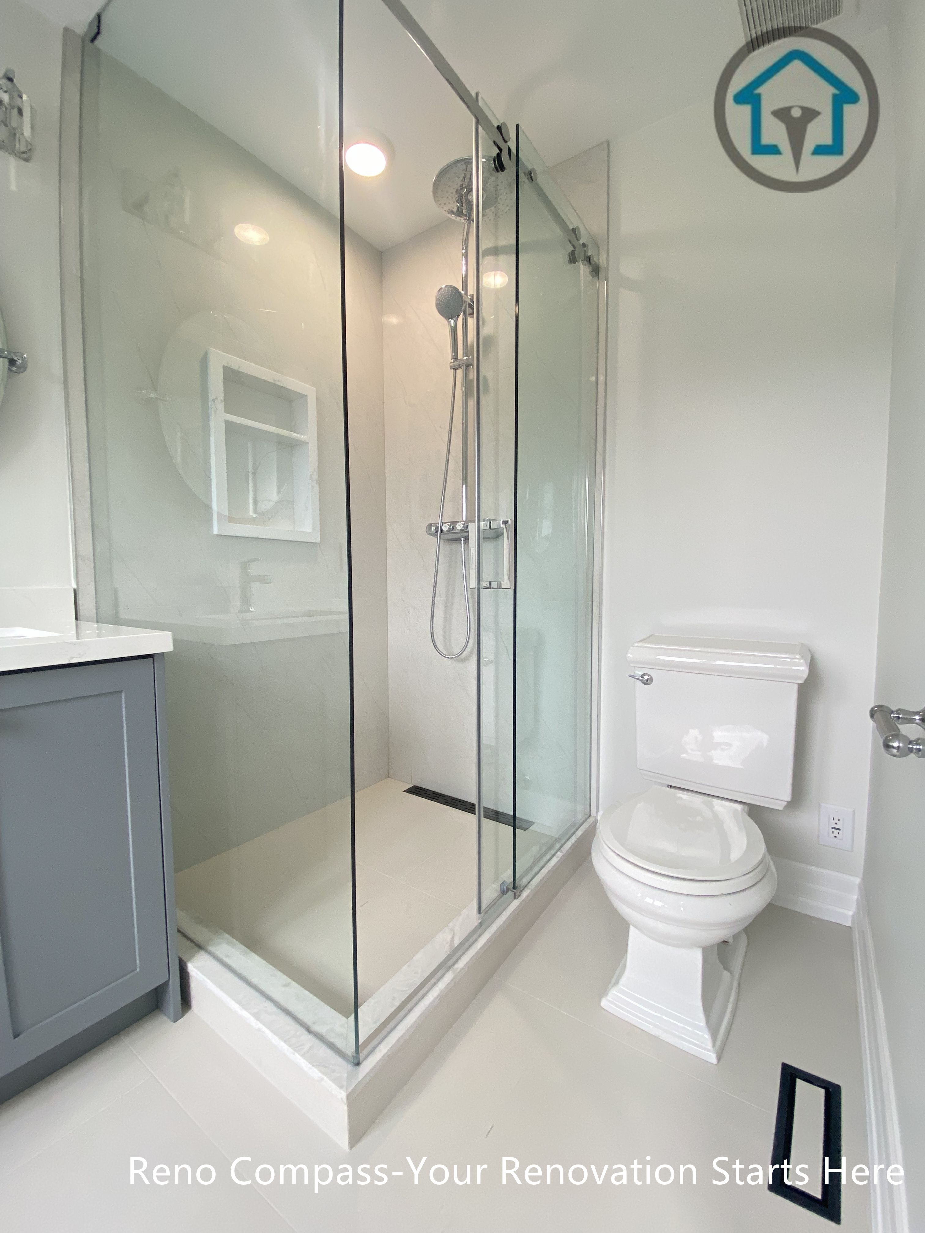 This bathroom features a well-balanced layout that maximizes space efficiency without sacrificing comfort. A frameless glass shower enclosure maintains visual openness, while light-toned porcelain tiles enhance brightness throughout the room. The streamlined vanity and simple fixture selection create a clean, modern bathroom designed for everyday use.