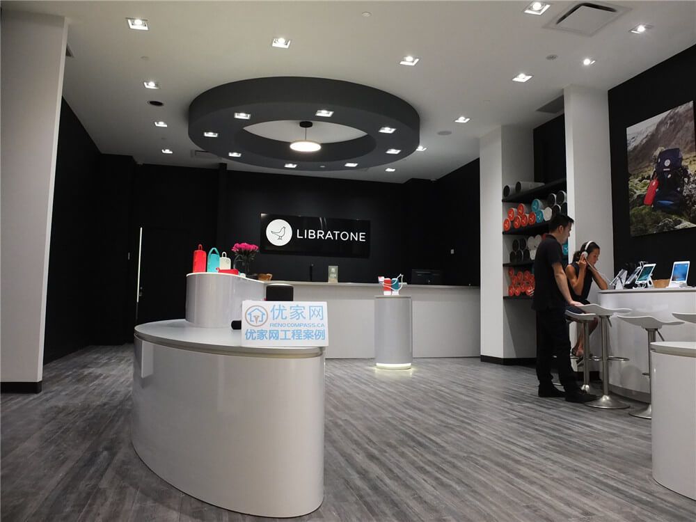 Modern retail store interior renovation inside Markville Mall featuring clean commercial flooring, custom product display counters, feature walls, integrated lighting, and digital display screens. This commercial renovation project focuses on creating a contemporary shopping environment with optimized customer flow, elegant product presentation, and durable finishes suitable for high-traffic retail spaces in a busy Toronto shopping mall.