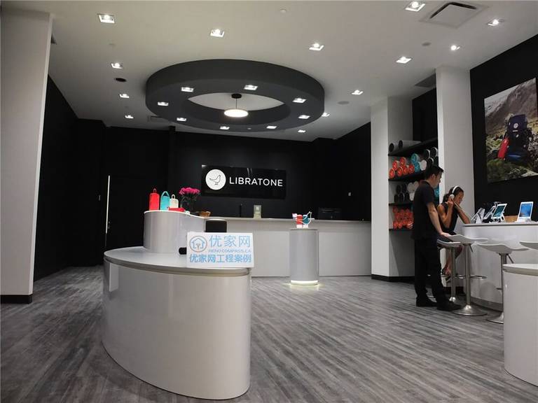 Modern retail store interior renovation inside Markville Mall featuring clean commercial flooring, custom product display counters, feature walls, integrated lighting, and digital display screens. This commercial renovation project focuses on creating a contemporary shopping environment with optimized customer flow, elegant product presentation, and durable finishes suitable for high-traffic retail spaces in a busy Toronto shopping mall.