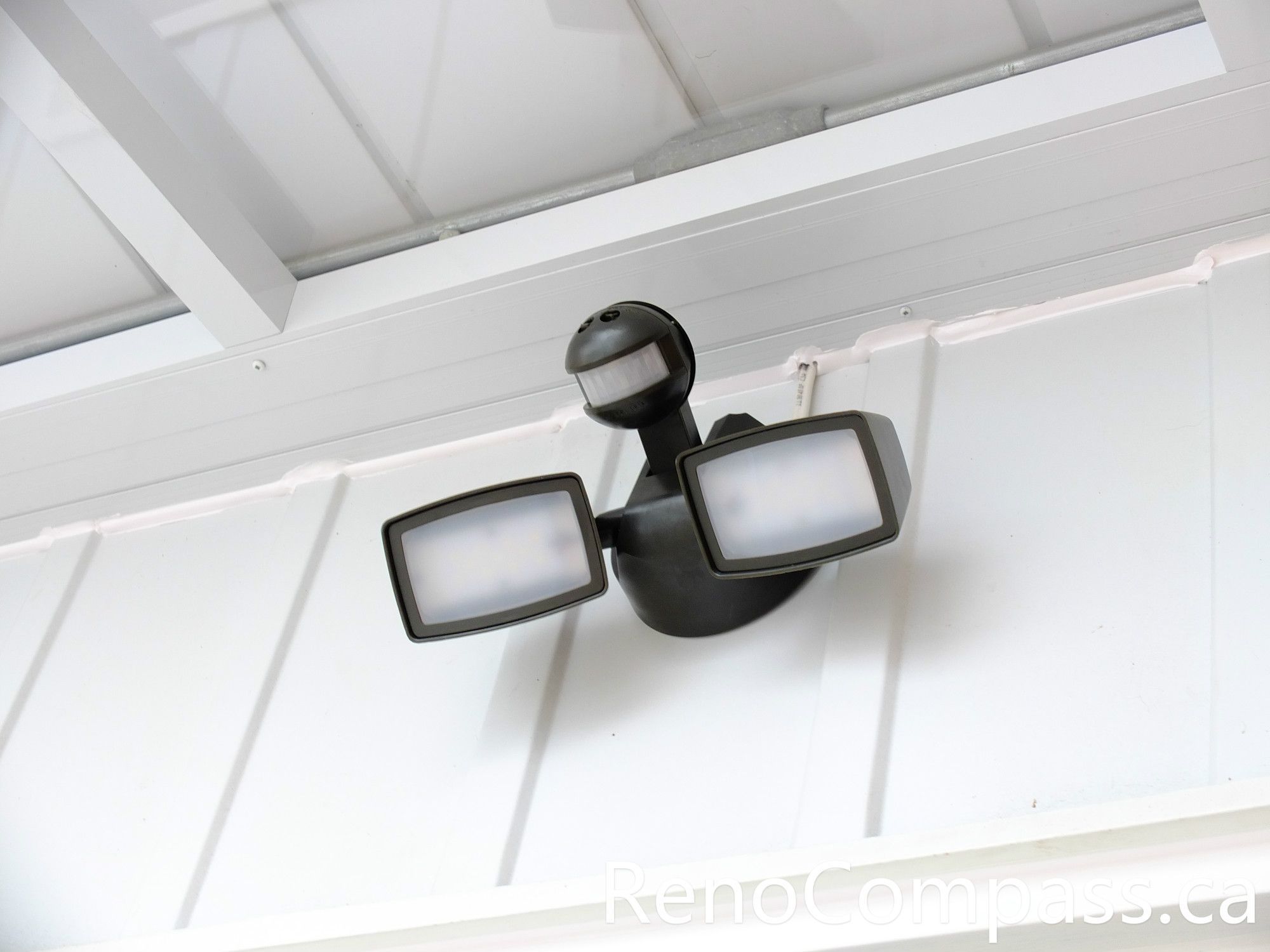 This image highlights the entrance lighting installed at a North York home as part of the front door storm door renovation project. The modern porch light improves nighttime visibility and enhances the safety of the entrance area while complementing the clean white glass vestibule design. Proper exterior lighting also adds warmth and curb appeal to the front entrance. Completed by a professional Toronto renovation team, this upgrade helps create a brighter, more welcoming home entry.
