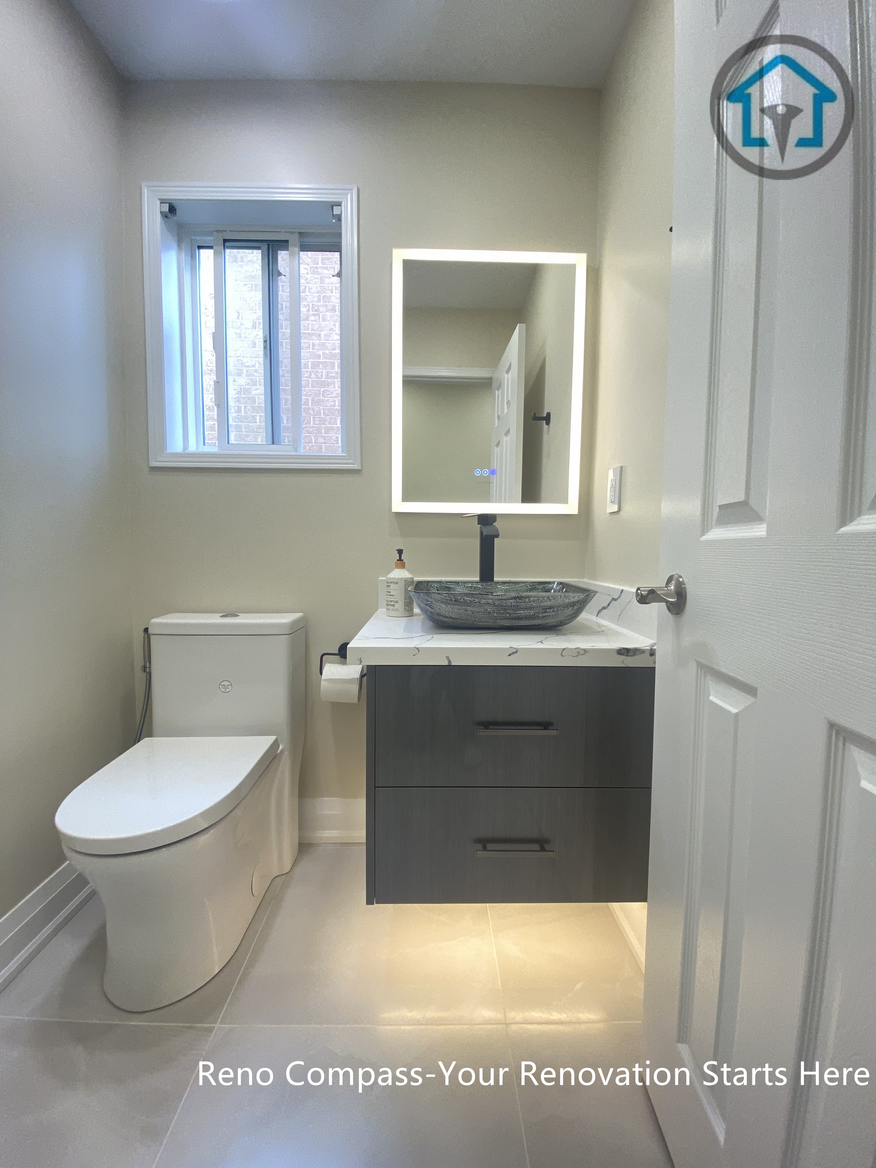 Interior view of a completed bathroom renovation in Vaughan, featuring a clean layout and functional design by Reno Compass.