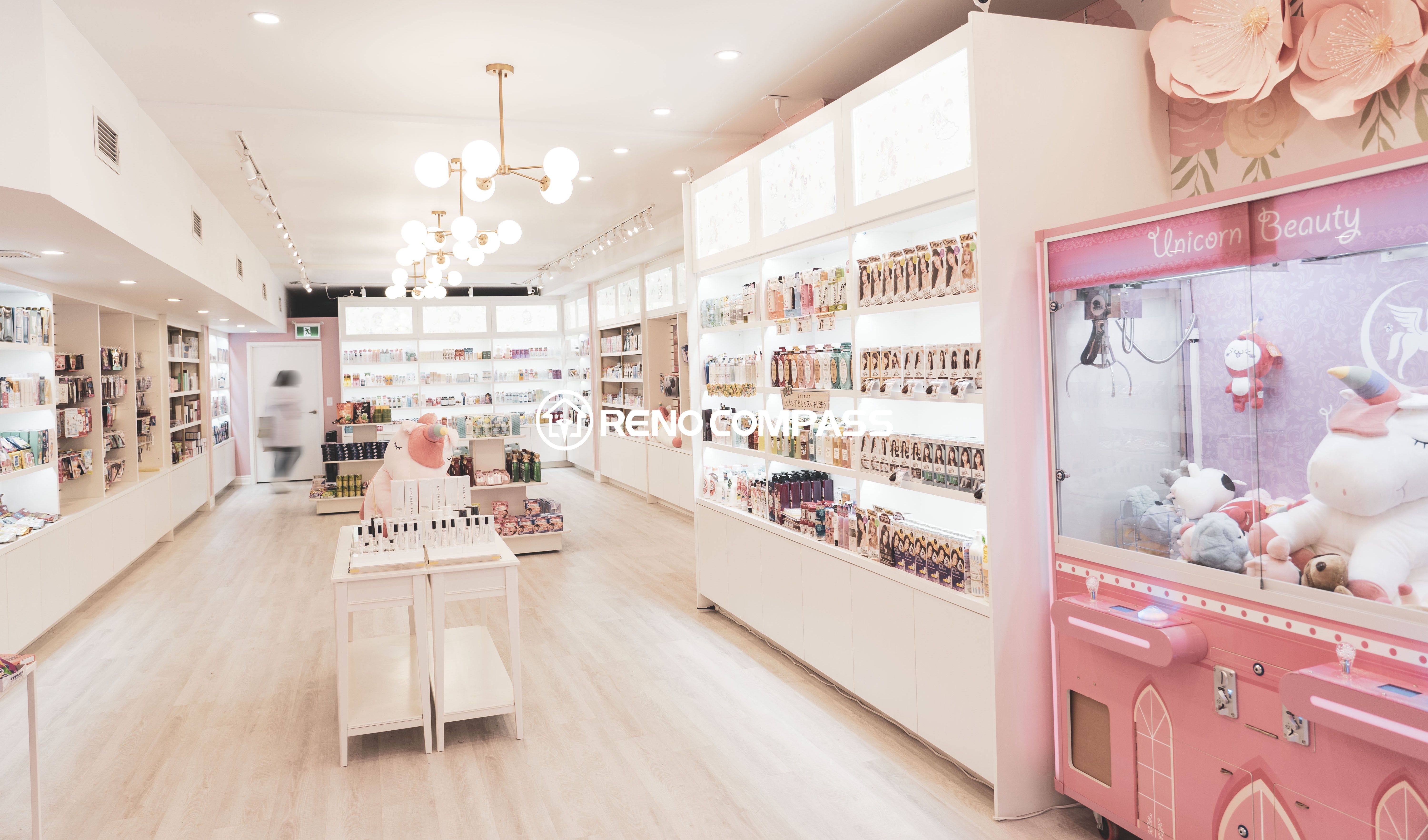 This Toronto beauty store renovation highlights a bright and elegant commercial retail interior featuring custom cosmetic display shelves, warm chandelier lighting, and organized product presentation. The spacious layout improves customer flow while showcasing makeup and skincare products in a clean, modern environment. Completed by a professional Toronto renovation company, the project blends stylish aesthetics with practical retail design to enhance the overall shopping experience.