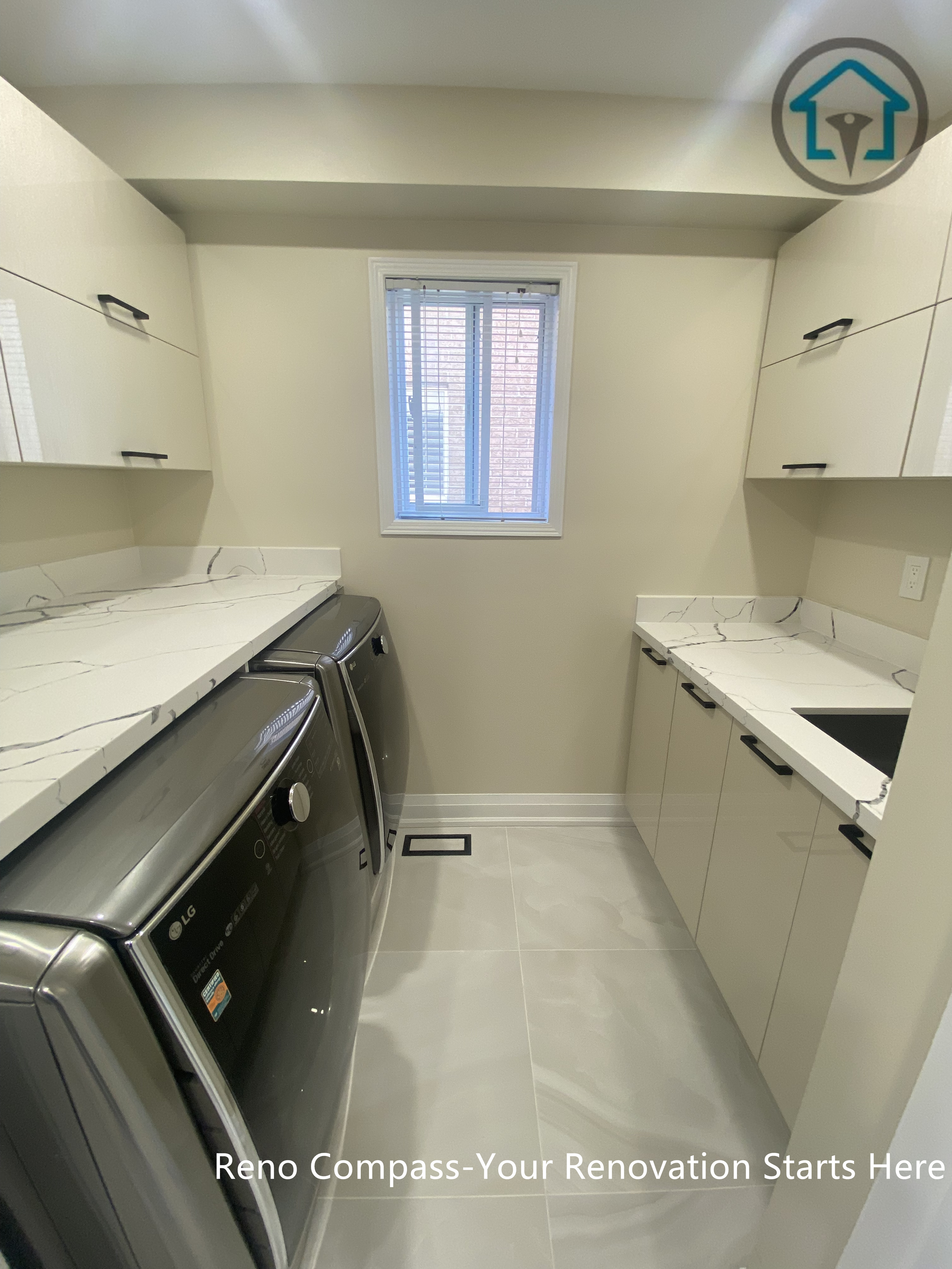 Laundry room view from a completed interior renovation project in Vaughan, featuring a clean and functional utility space by Reno Compass.