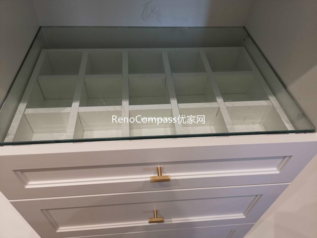 This Richmond Hill custom closet renovation includes built-in drawer organizers with glass top display, tailored storage compartments, and elegant cabinetry hardware. Designed for efficient organization and a luxury finish, the custom millwork reflects the craftsmanship of a trusted Toronto renovation company specializing in full house interior and storage solutions.