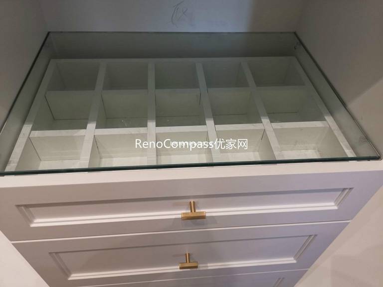 This Richmond Hill custom closet renovation includes built-in drawer organizers with glass top display, tailored storage compartments, and elegant cabinetry hardware. Designed for efficient organization and a luxury finish, the custom millwork reflects the craftsmanship of a trusted Toronto renovation company specializing in full house interior and storage solutions.