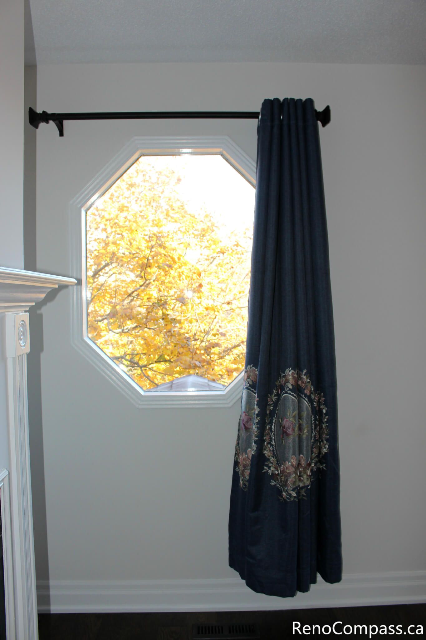 This Mississauga interior renovation highlights a beautifully upgraded window area featuring a unique octagon window design, custom curtain installation, and clean modern wall finishes. The renovation enhances natural light flow while adding warmth and elegance to the space, reflecting the detailed craftsmanship and design expertise of a professional Toronto renovation company, Reno Compass Inc.