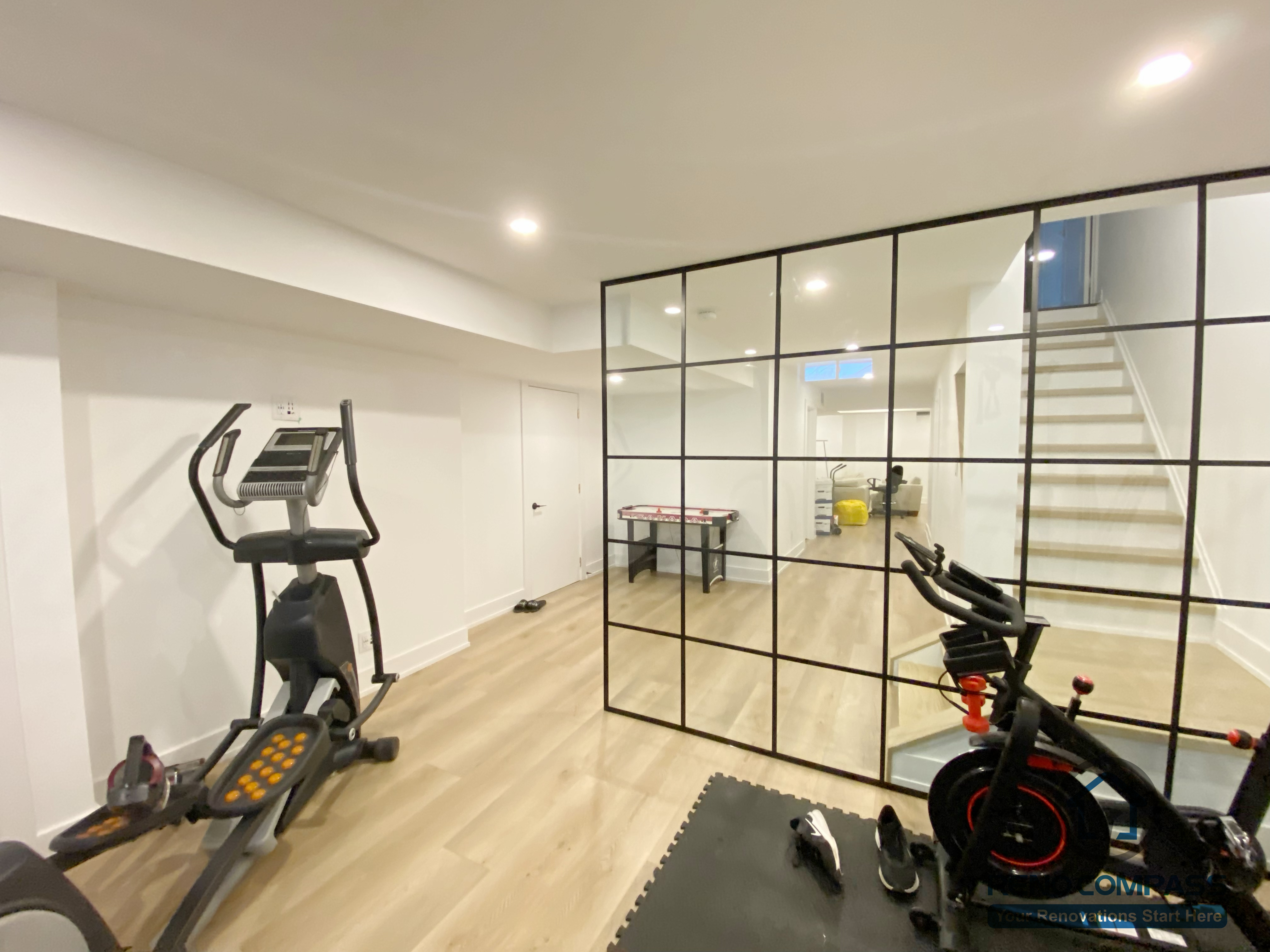 This basement gym room provides a dedicated home fitness space with a clean, modern design. Durable finishes and efficient lighting make it ideal for daily workouts as part of this Markham basement renovation.
