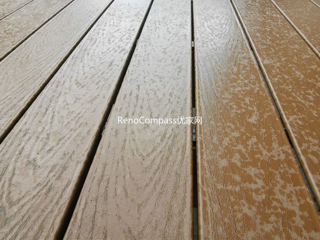 Close-up view of high-quality composite decking used in an Aurora backyard renovation project. The durable, weather-resistant deck boards provide a natural wood appearance with low maintenance, ensuring long-lasting performance and a modern outdoor living space upgrade.