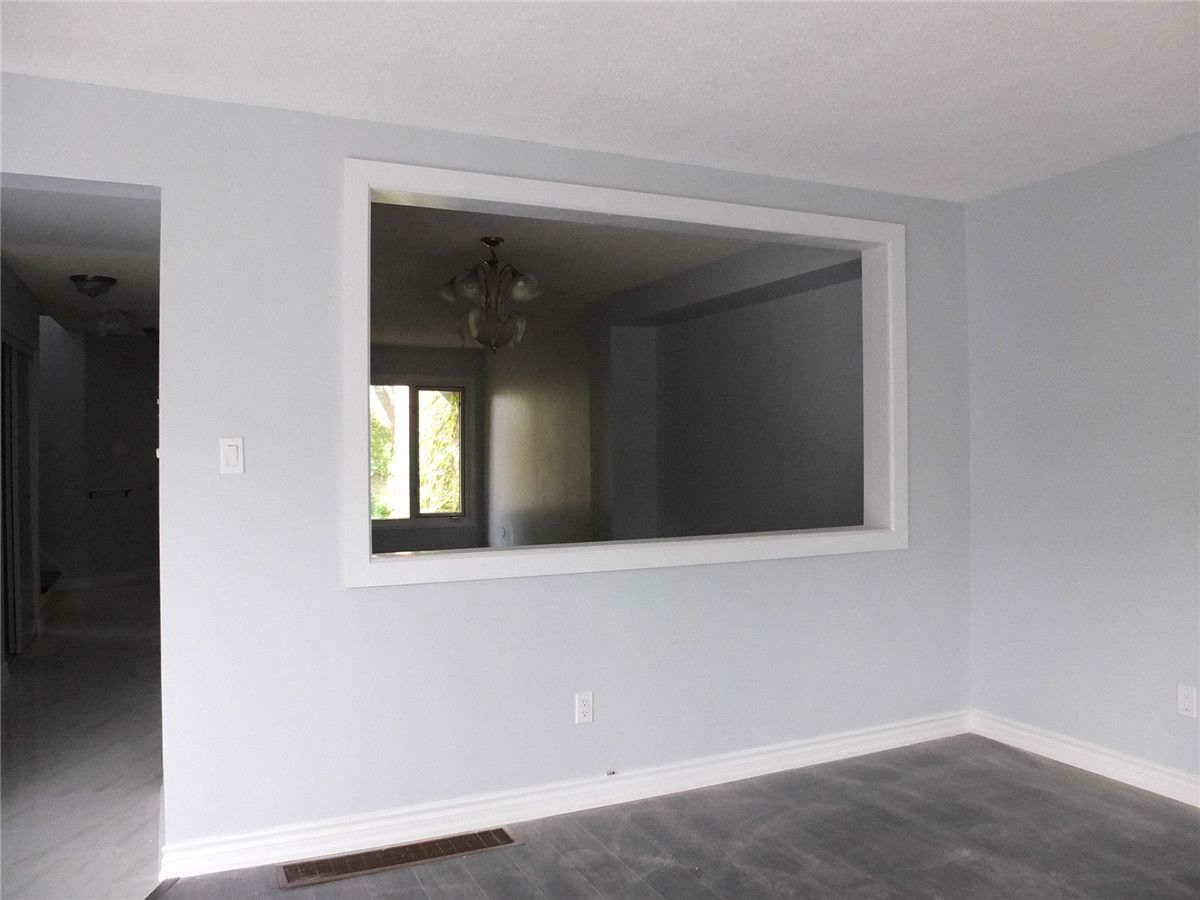 This Mississauga interior renovation features a custom open wall design that enhances sightlines and natural light between living spaces. Newly updated flooring, fresh neutral wall finishes, and clean trim detailing create a modern and cohesive interior environment. The improved layout allows for better flow and functionality while maintaining distinct living areas. Designed for everyday comfort and long-term durability, this renovation was completed by a professional Toronto renovation company specializing in high-quality interior home upgrades.