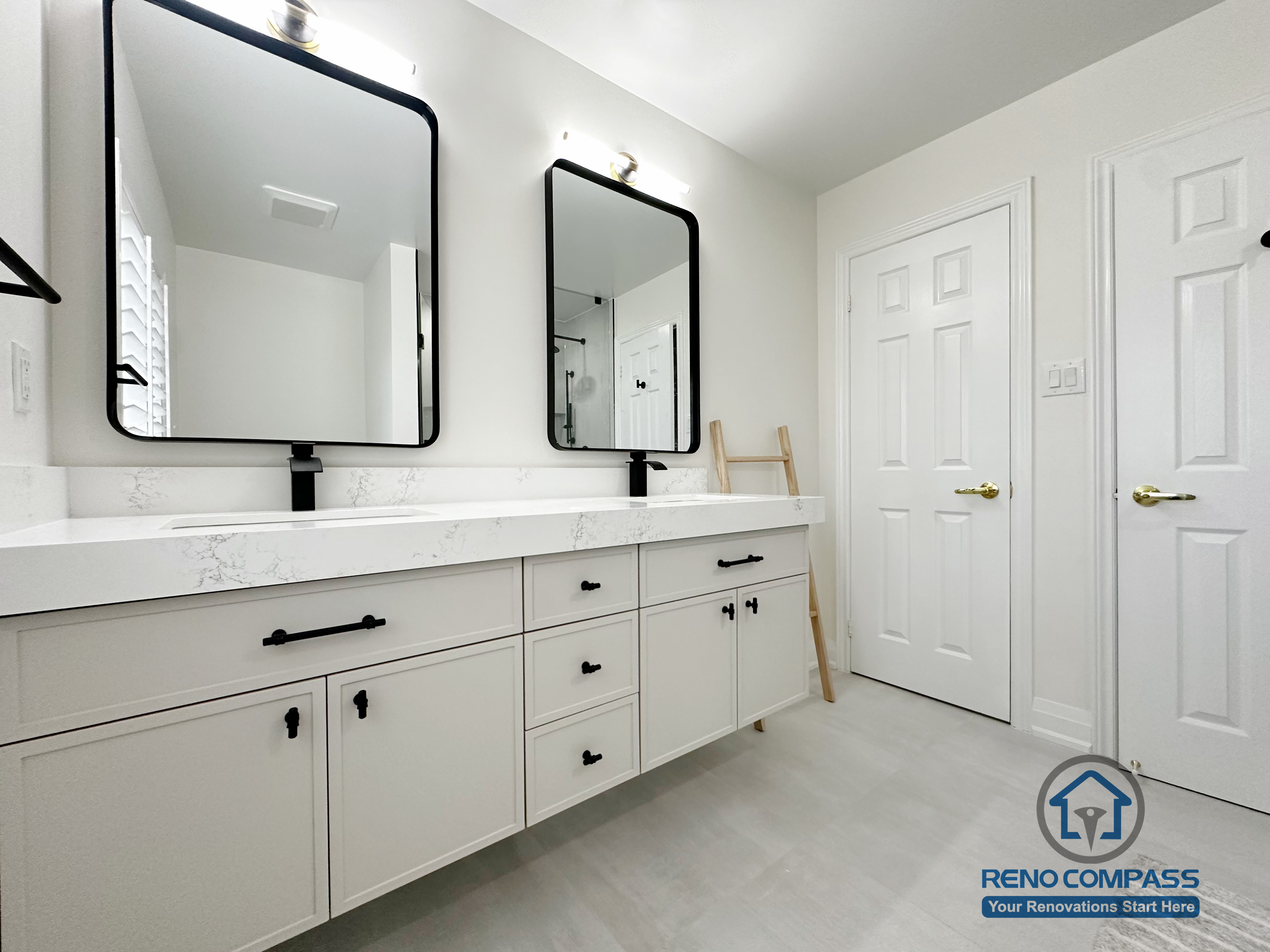 This Markham bathroom renovation features a clean double vanity layout with custom cabinetry, quartz countertops, and matte black fixtures. Dual framed mirrors and balanced lighting enhance functionality while maintaining a calm, modern aesthetic. Designed for daily comfort, storage efficiency, and long-term durability.