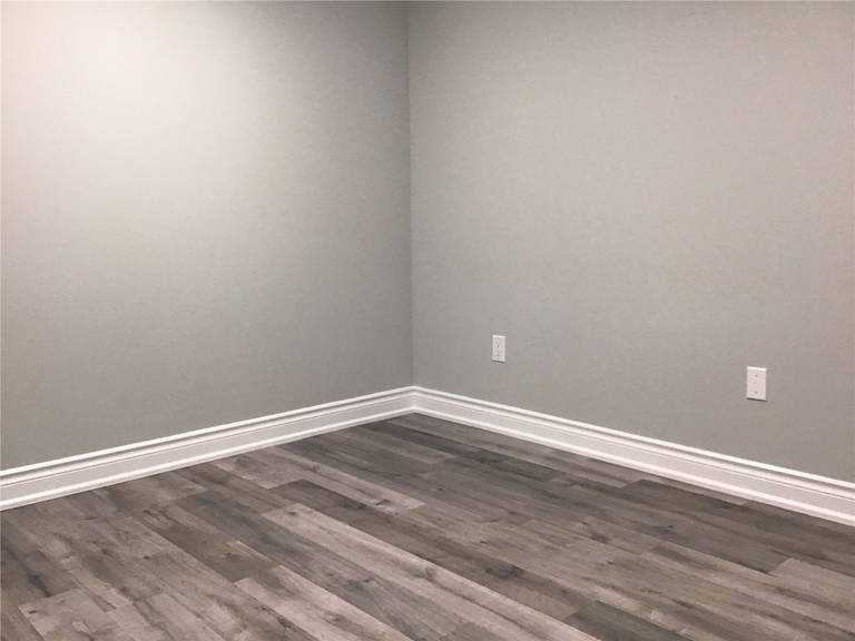 High-quality grey-toned vinyl plank flooring installed in this Newmarket basement renovation. The modern wood-look finish adds warmth, durability, and a clean contemporary feel, making the space both stylish and functional for everyday living.