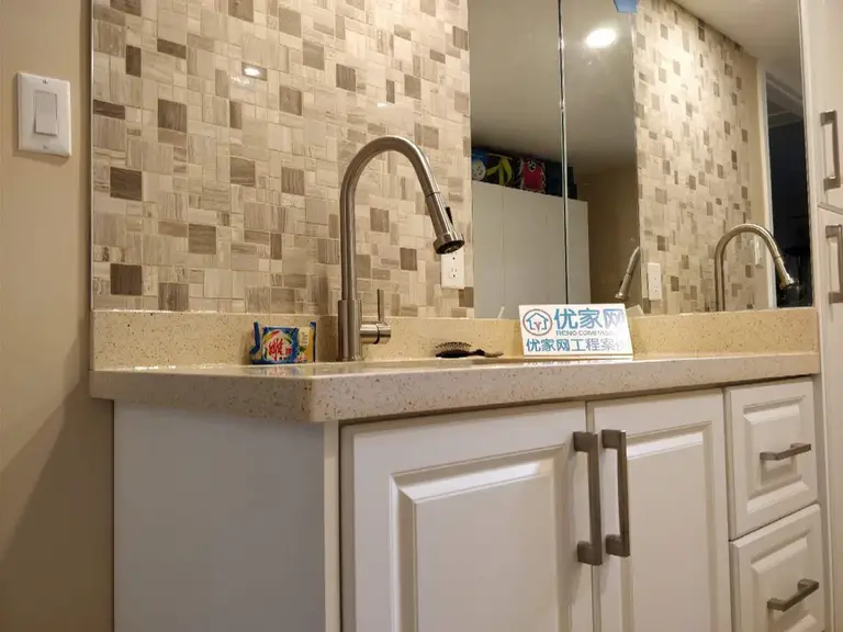 A professional basement transformation by Reno Compass in Scarborough. This project highlights modern space-saving solutions, including a custom wet bar and premium cabinetry installations.
