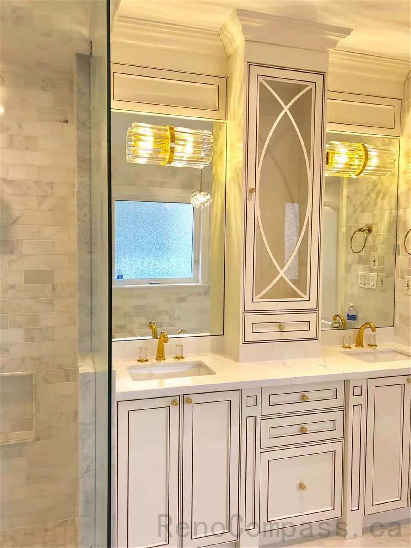 This North York bathroom renovation features a luxury double vanity with custom cabinetry, integrated storage, and elegant gold fixtures. Large mirrors, decorative wall panels, and layered lighting enhance brightness and symmetry, creating a refined and functional primary bathroom designed for comfort and daily use.