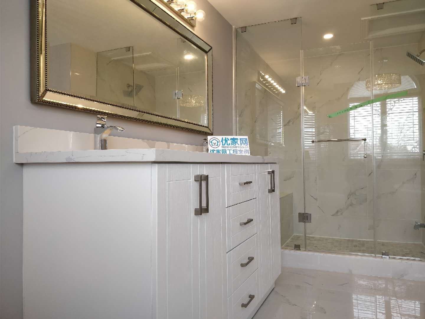This modern bathroom renovation in Ajax features a double sink vanity with quartz countertop, a large framed mirror with upgraded lighting, and a glass-enclosed walk-in shower. The clean layout and premium materials create a spa-like atmosphere while improving daily functionality. As part of a full house renovation, this bathroom design combines elegance, durability, and modern comfort.
