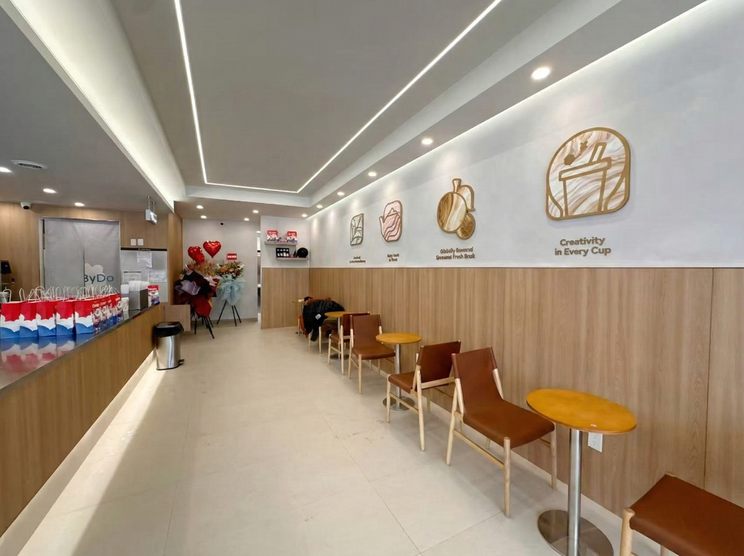 This newly renovated bubble tea shop in North York features a modern seating area with custom wall paneling, warm lighting design, and optimized customer flow. Completed by a professional Toronto renovation company, the commercial space combines clean aesthetics with functional layout, creating a comfortable and stylish environment for customers to relax and enjoy their drinks.