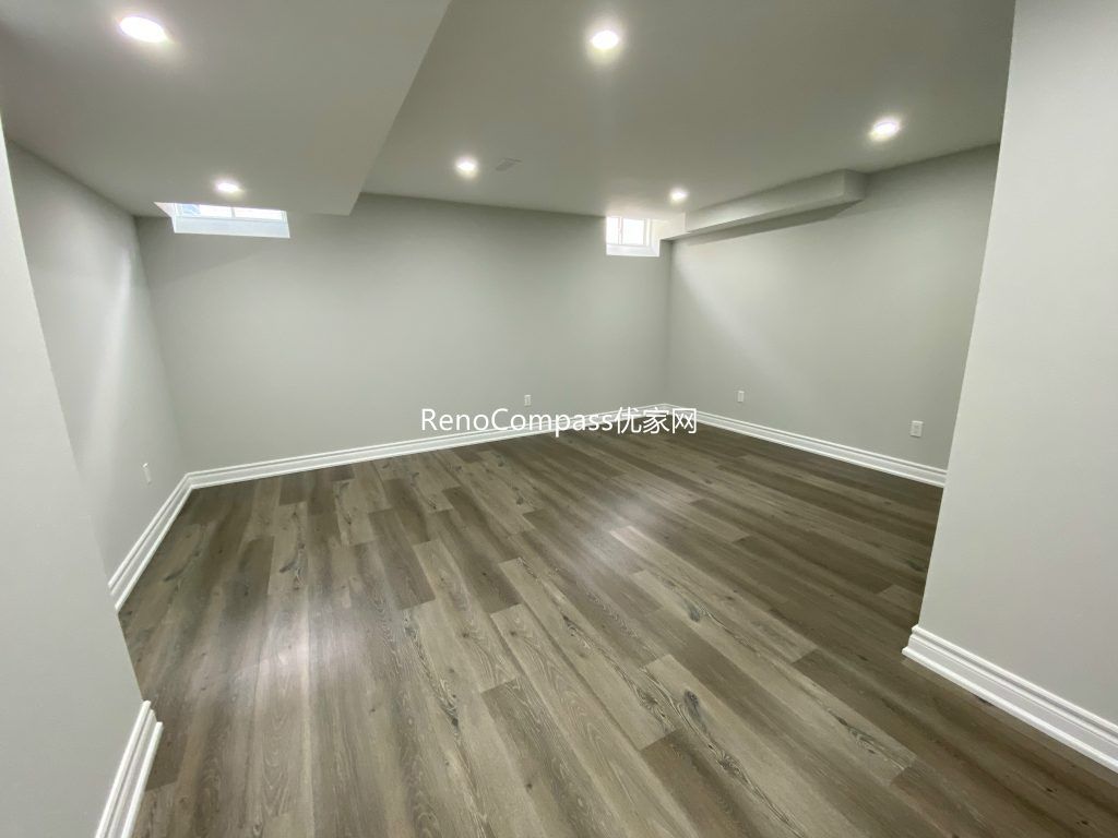A Richmond Hill basement makeover with rich laminate flooring and smooth paint finishing. Reno Compass brought warmth and sophistication to this comfortable and inviting home interior.
