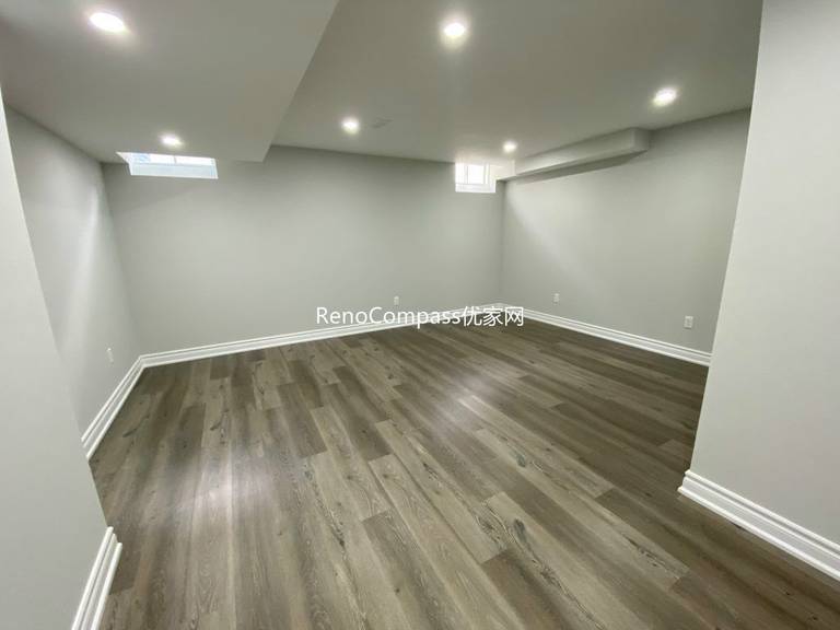 A Richmond Hill basement makeover with rich laminate flooring and smooth paint finishing. Reno Compass brought warmth and sophistication to this comfortable and inviting home interior.