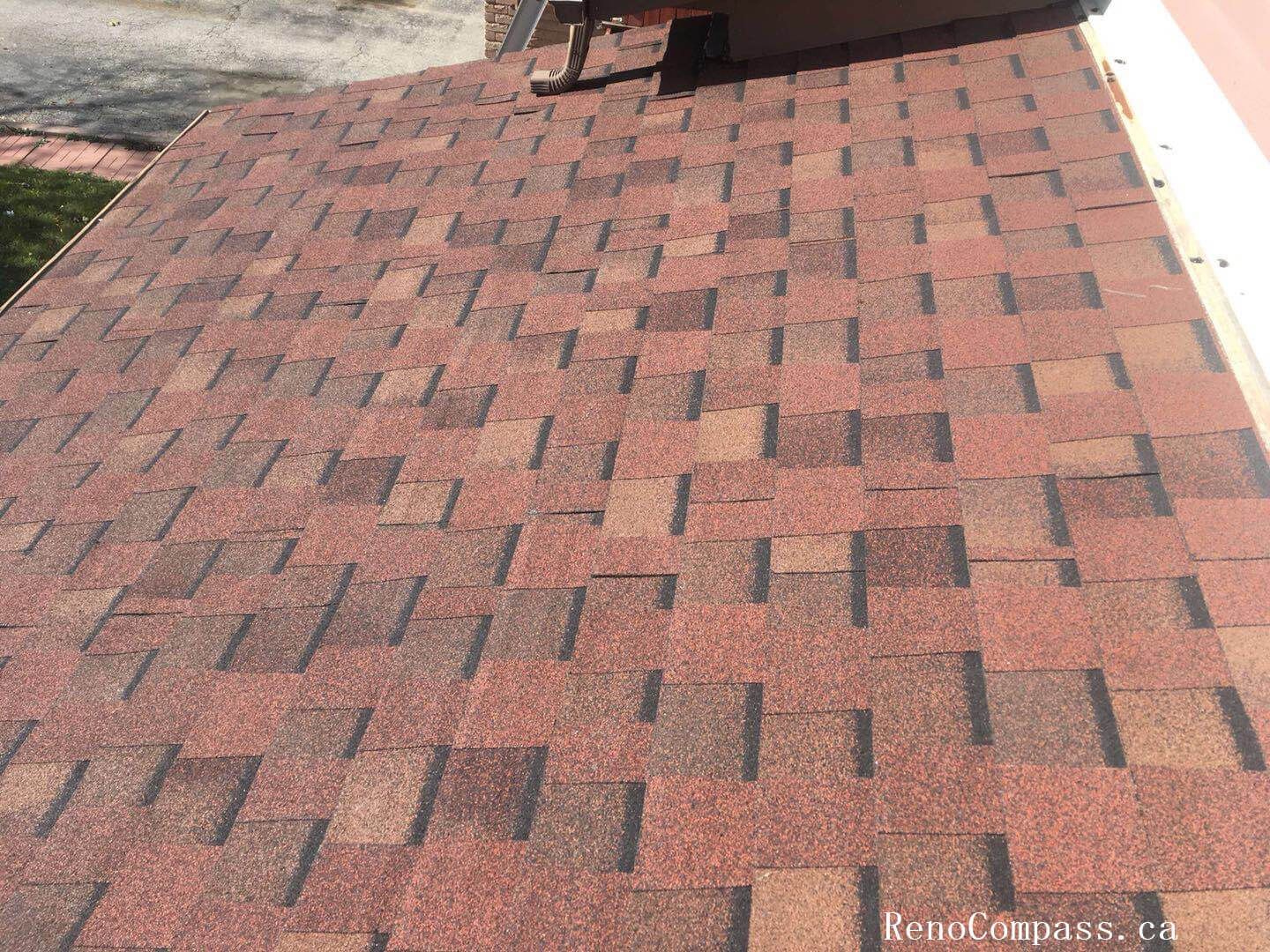 This image highlights a completed roofing replacement project in Toronto, featuring newly installed asphalt shingles designed for durability and long-term weather protection. The roofing system includes properly aligned shingle installation and upgraded roof ventilation units to improve airflow and prevent moisture buildup. Careful attention was given to roof slope consistency, flashing details, and overall finishing to ensure reliable performance through Toronto’s harsh winters and seasonal changes. Completed by an experienced Toronto roofing and renovation team, the project enhances both structural protection and the home’s exterior appearance while maintaining high installation standards.