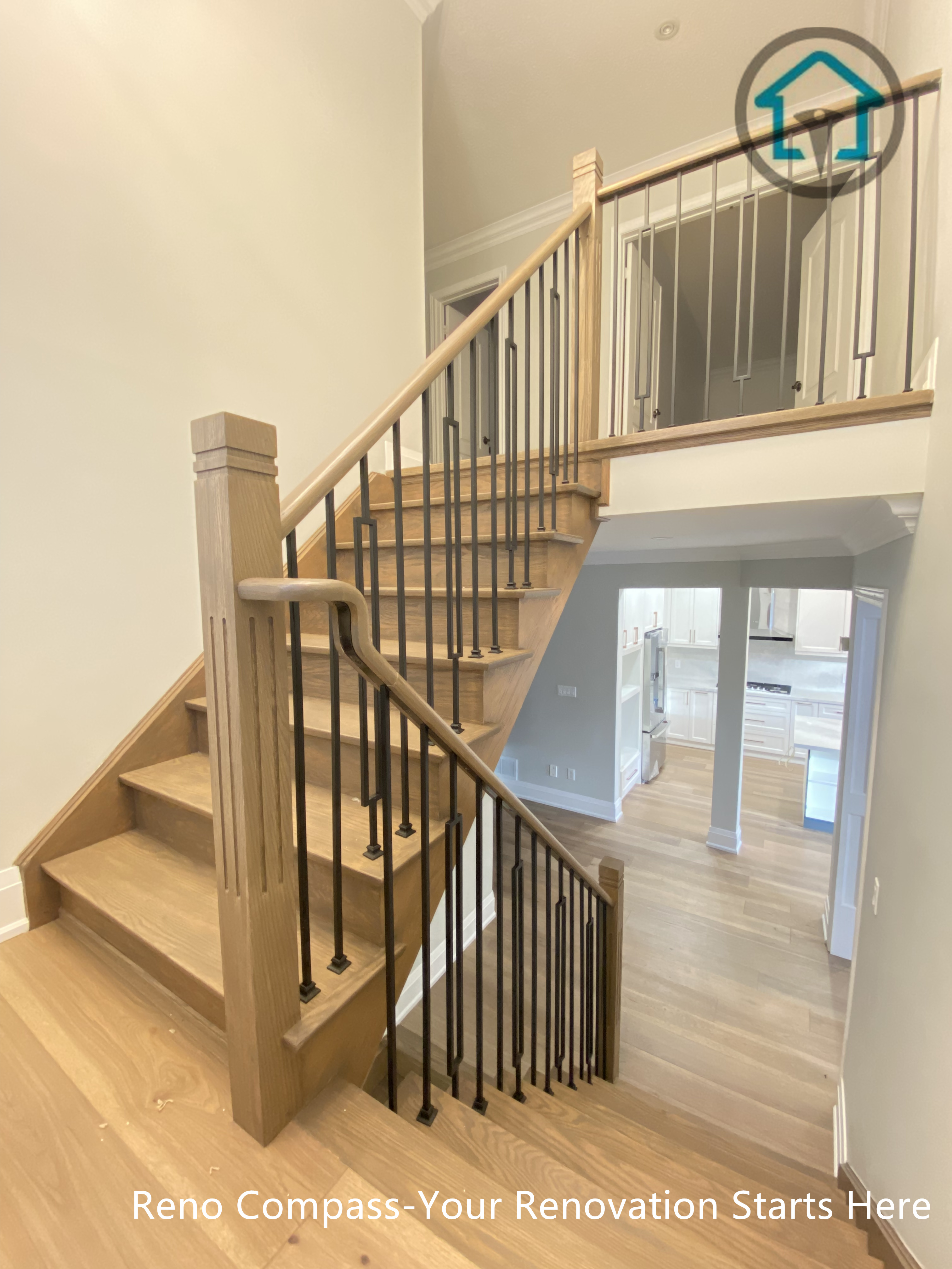 This image showcases a completed flooring and staircase renovation project in Richmond Hill, featuring modern wood stair treads, matching hardwood flooring, and sleek black iron railings. The updated staircase design enhances safety, flow, and visual continuity between levels, creating a bright and contemporary interior look. Completed by an experienced Toronto renovation company, the project focuses on durable materials, clean detailing, and long-term residential use.