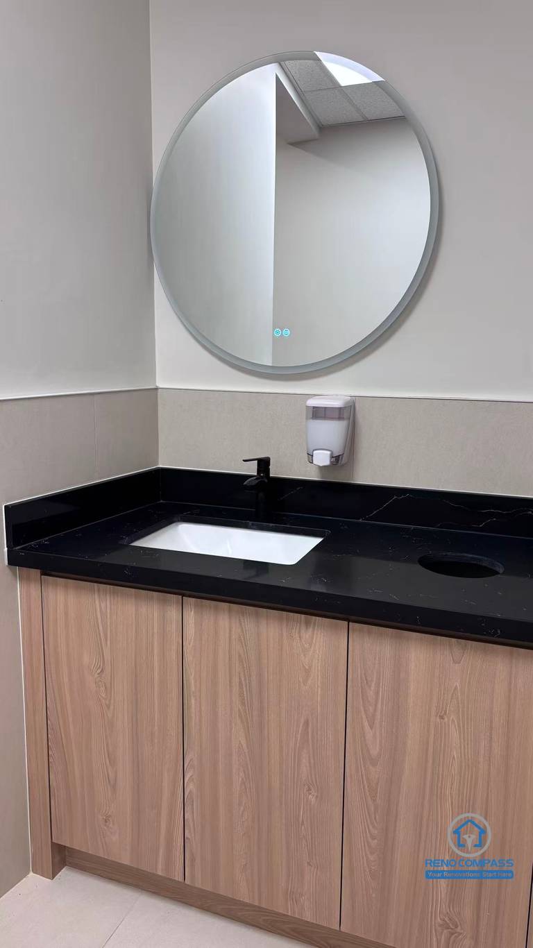This North York commercial renovation includes a modern washroom vanity installation with custom cabinetry, black countertop, and upgraded sink fixtures. Completed by a professional Toronto renovation company, the project focuses on clean design, durability, and functionality to support daily operations in a busy bubble tea shop environment.