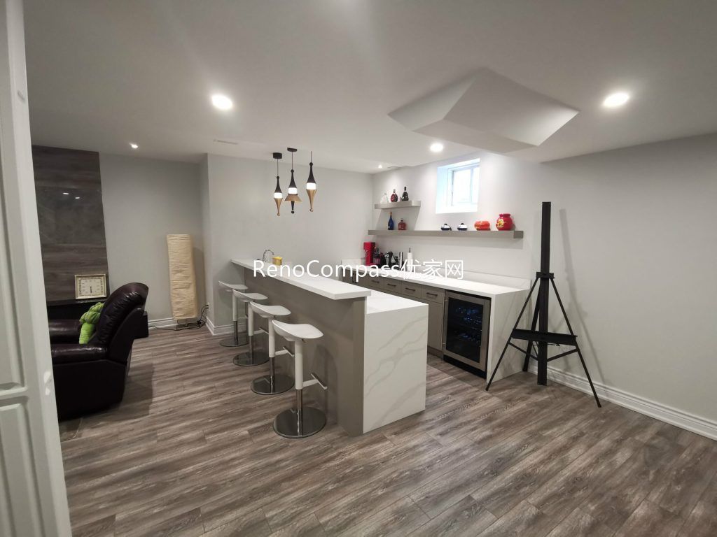 This Richmond Hill basement renovation features a modern entertainment space with custom bar counter, built-in shelving, upgraded flooring, and recessed lighting. Designed for relaxation and hosting, the functional layout and clean finishes showcase the craftsmanship of a trusted Toronto renovation company specializing in full house interior and basement renovations.