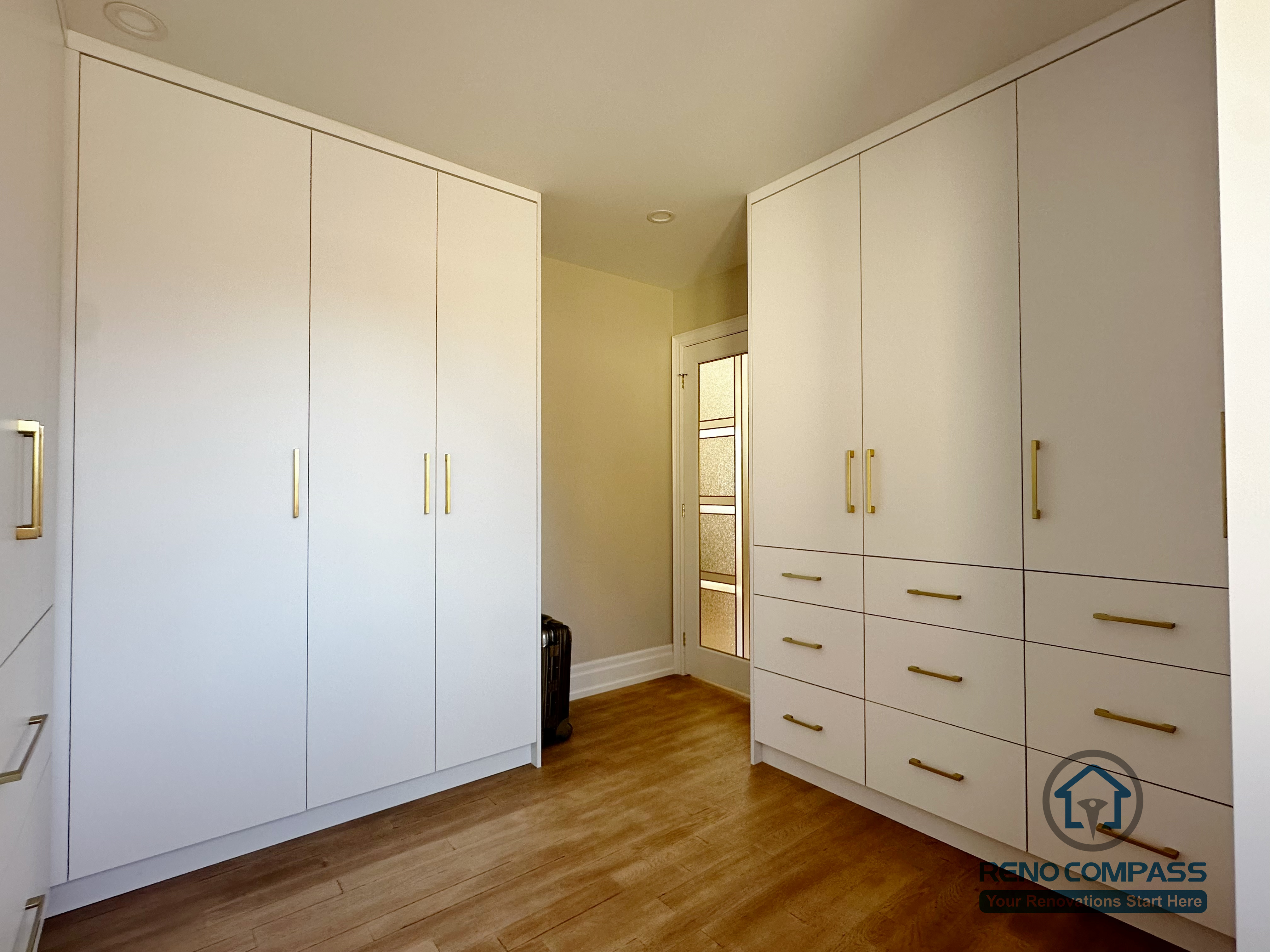 This North York kitchen renovation includes a dedicated pantry and storage zone featuring full-height custom cabinets and integrated drawers. Designed for organization and long-term functionality, this storage-focused layout keeps the main kitchen visually clean while providing generous capacity, completed by Reno Compass with precision craftsmanship.