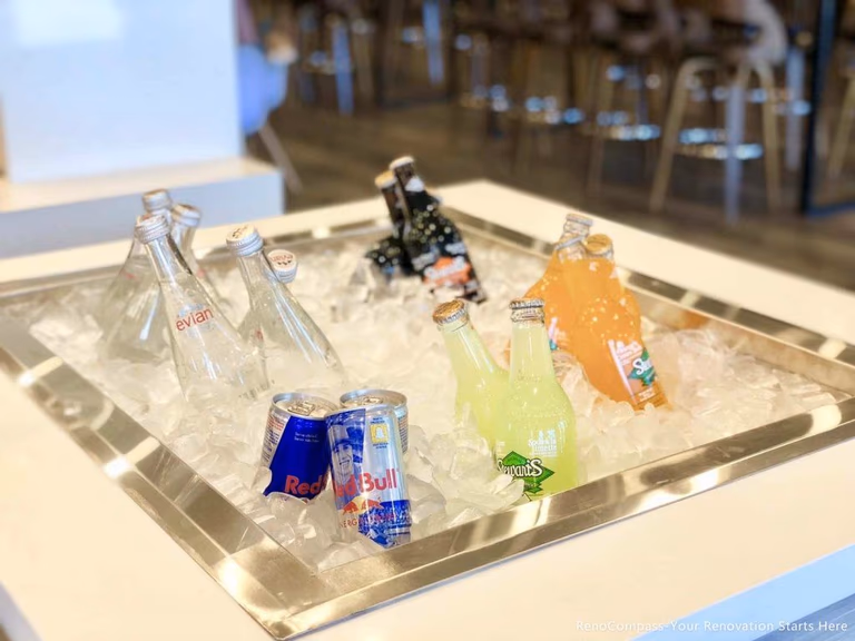 This Barrie commercial tea shop renovation features a custom-built beverage display counter designed for functionality and customer experience. The built-in ice display and clean countertop design enhance both presentation and workflow efficiency for busy bubble tea and café operations. Completed by Reno Compass Inc., a professional Toronto renovation company, this project highlights modern commercial construction tailored for food and beverage businesses.