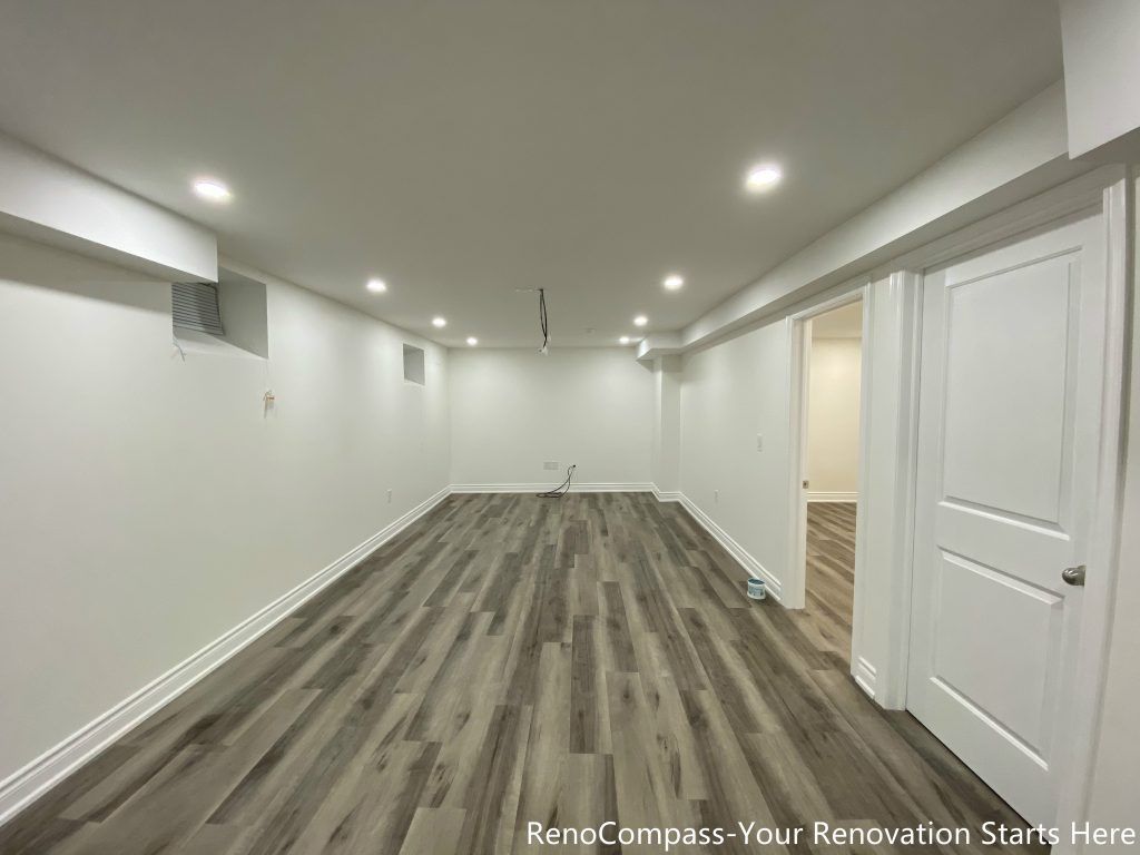 This Richmond Hill basement renovation showcases the main entertainment and multi-purpose area with newly installed flooring, recessed ceiling lights, and clean wall finishes. The long, open layout provides flexibility for a family room, home theater, or recreational space, while consistent materials and lighting help create a bright, comfortable basement environment.
City: Richmond Hill · Toronto contractor: Reno Compass