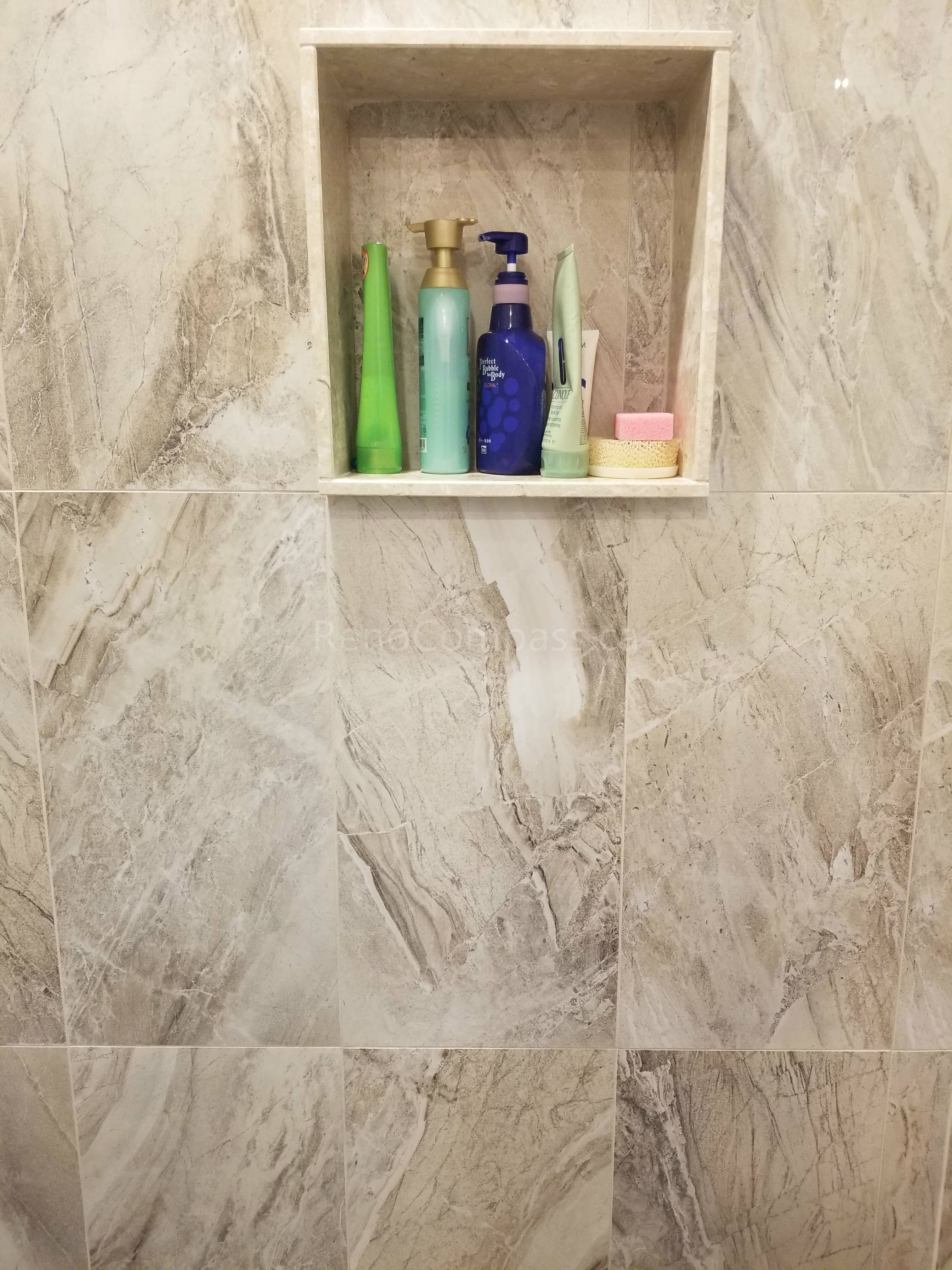 This Markham bathroom renovation features newly installed shower wall tiles with a built-in recessed niche for convenient storage. The modern tile design enhances both functionality and visual appeal, providing a clean, elegant finish that is easy to maintain. As part of a full bathroom upgrade including new flooring, shower, and vanity, the space now offers improved comfort, durability, and a contemporary look for everyday use.