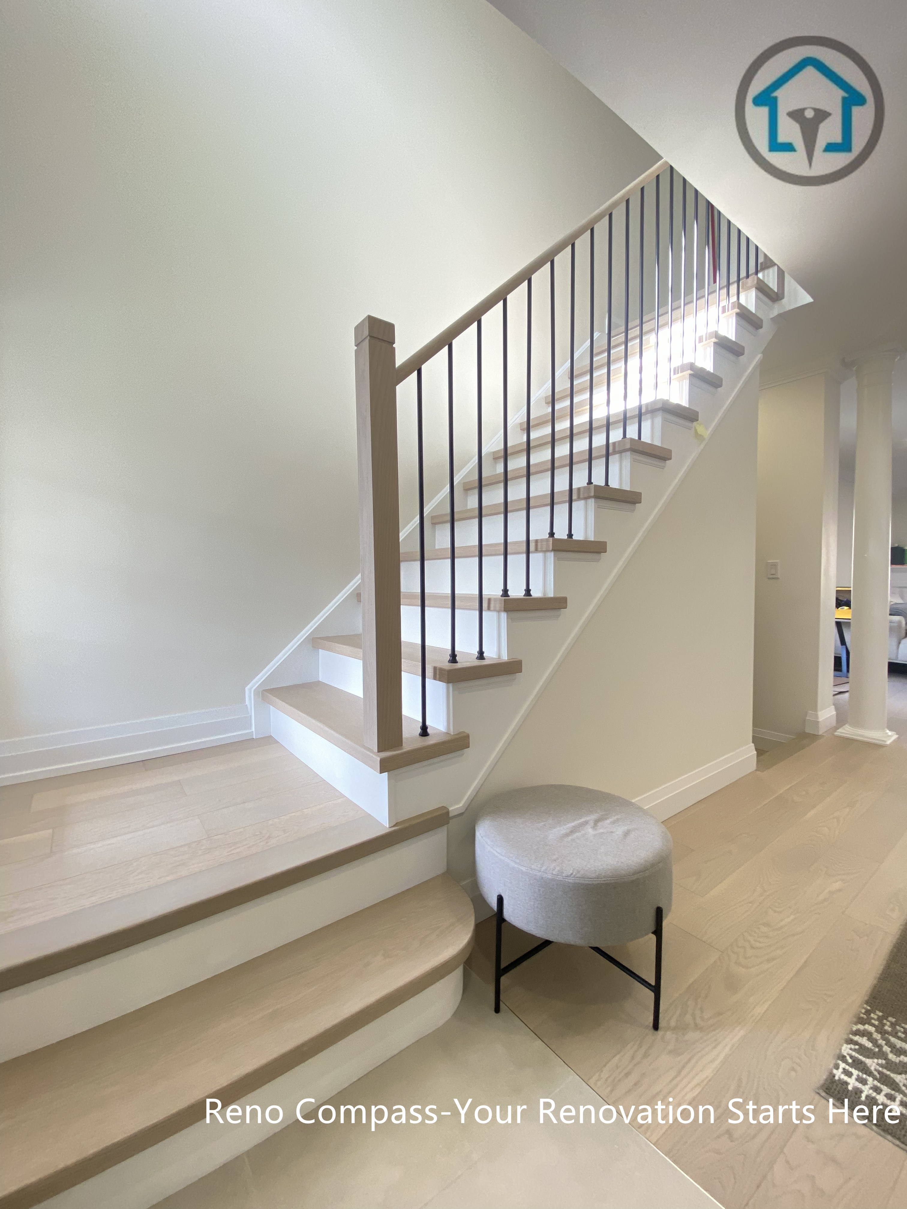Open concept living room renovation in Markham featuring light-toned hardwood flooring, recessed ceiling lighting, and a seamless layout connecting the living area, dining space, and kitchen. The continuous flooring design enhances spatial flow and brightness, creating a modern, comfortable home environment completed by a professional Toronto renovation company.