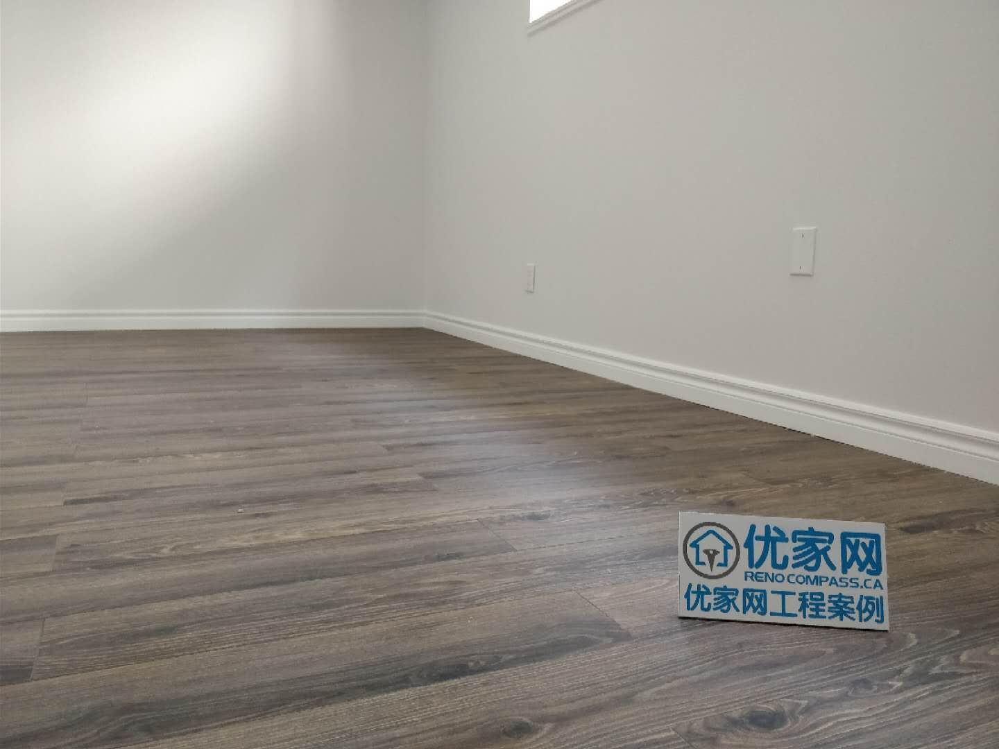 This Scarborough basement renovation features a clean and modern finished living space with durable vinyl flooring, smooth painted walls, and upgraded baseboards. A high basement window allows natural light to brighten the room, creating a comfortable and functional area suitable for a recreation room, home office, or additional living space. Completed with attention to detail, this basement upgrade improves both usability and property value for the homeowner.