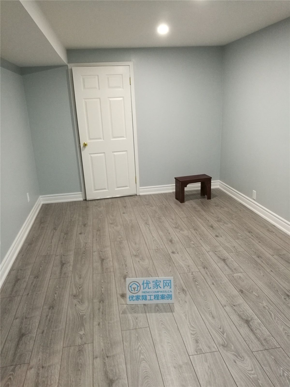 This image shows a completed room as part of a North York interior renovation, featuring durable vinyl plank flooring, soft neutral wall colors, and recessed pot lighting. Clean white baseboards and a simple layout create a bright, comfortable space suitable for a bedroom, home office, or multipurpose room. The renovation emphasizes practicality, clean finishes, and long-term durability, reflecting the standards of a professional Toronto renovation company serving the North York area.