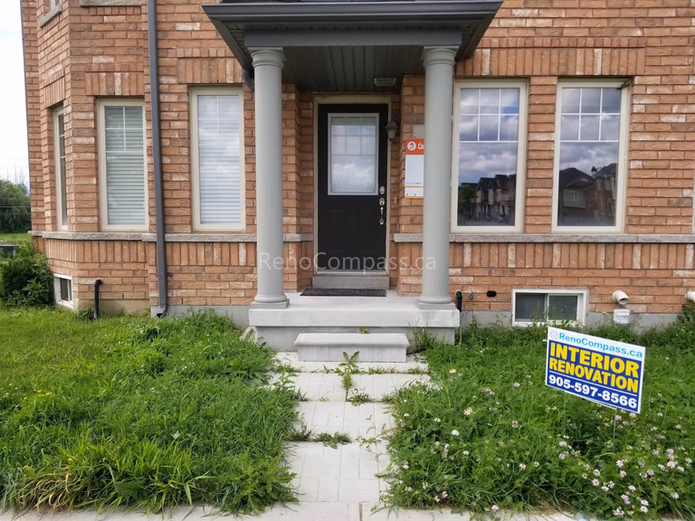 Front exterior view of a Markham basement renovation project by Reno Compass, showcasing the home’s entrance, brick façade, and upgraded property prepared for interior renovation. This project highlights professional planning and full-service residential renovation expertise in Markham and the Greater Toronto Area.