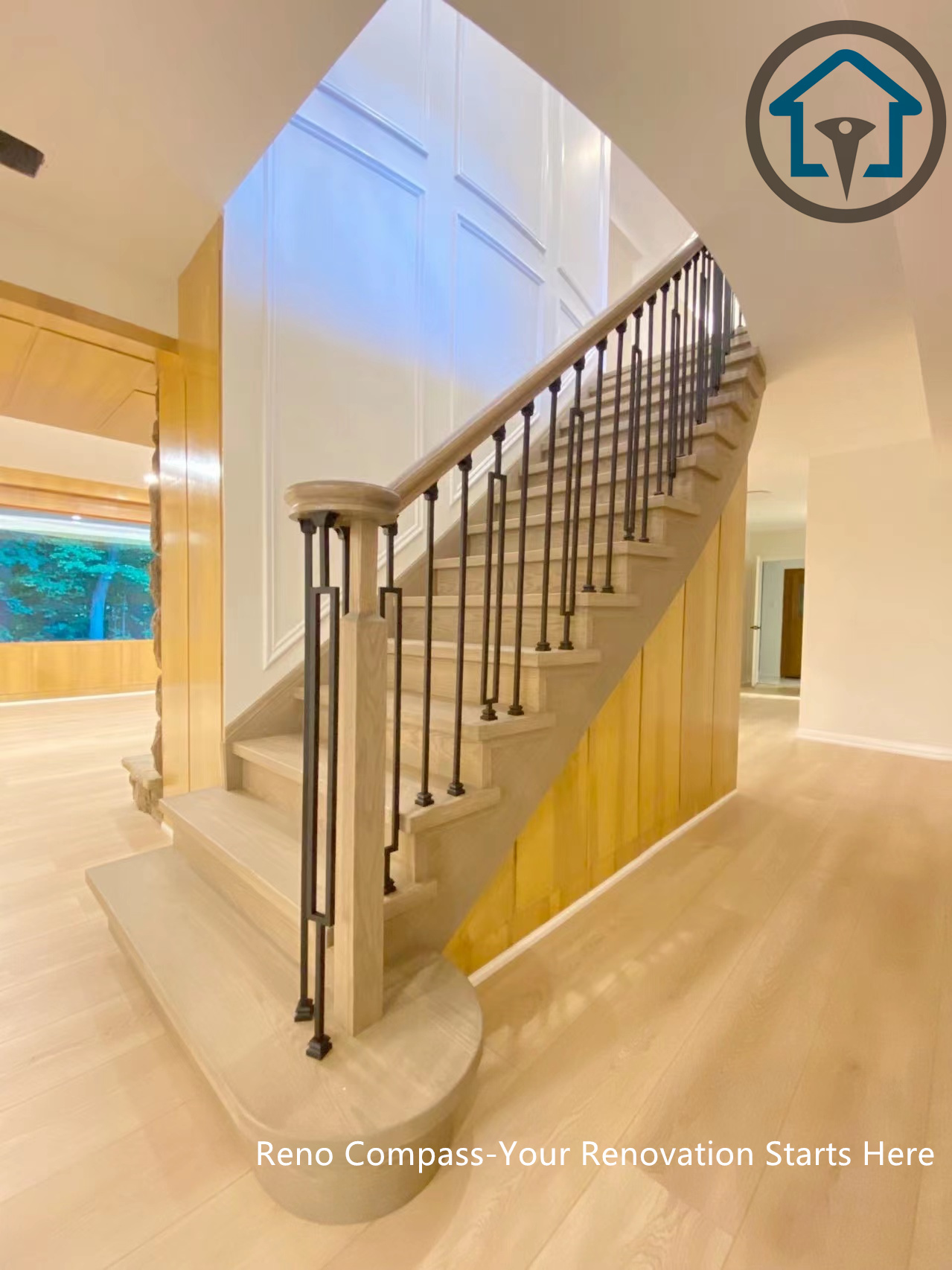This image captures the staircase and its connection to the main floor in a North York house renovation. The redesigned stair structure, light wood flooring, and black metal railings create a smooth visual transition between levels, improving circulation, openness, and the overall spatial flow of the home.