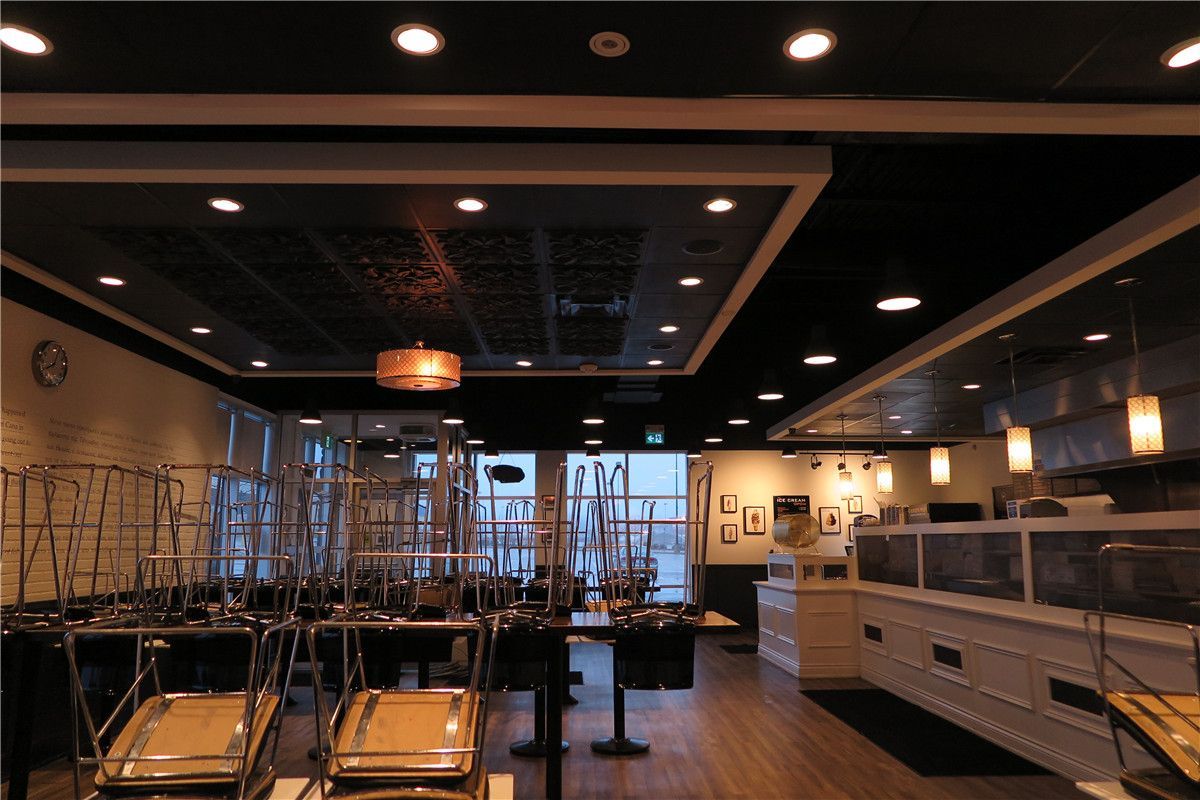 This Toronto restaurant renovation project highlights the custom ceiling design and upgraded dining area lighting completed by Reno Compass Inc. The project included suspended ceiling features with integrated recessed lighting, decorative ceiling panels, and modern pendant fixtures to enhance visual depth and ambiance.

The redesigned dining space offers improved spatial balance, consistent lighting coverage, and a clean architectural finish that elevates the overall customer experience. Durable commercial-grade flooring ensures long-term performance in high-traffic restaurant environments.

As a professional Toronto renovation company, Reno Compass Inc. delivers restaurant interior upgrades that combine design aesthetics with practical commercial functionality.
