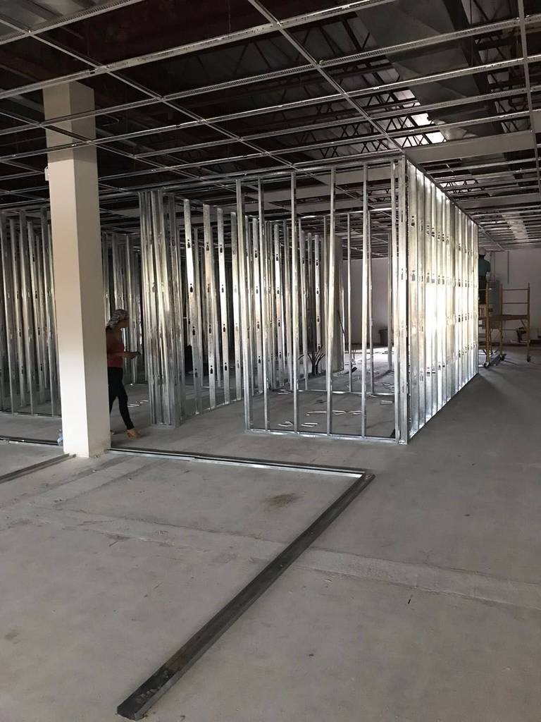 This Toronto commercial renovation project showcases the structural phase of a professional office build-out featuring steel stud framing installation. The open commercial space is being transformed into multiple functional rooms through precise metal framing, ensuring durability, fire resistance, and long-term structural stability.

The layout planning supports efficient workflow and future mechanical and electrical integration, making it ideal for offices, clinics, and commercial facilities across the GTA. As part of a comprehensive Toronto commercial renovation, this framing stage sets the foundation for drywall finishing, ceiling installation, and final interior detailing.