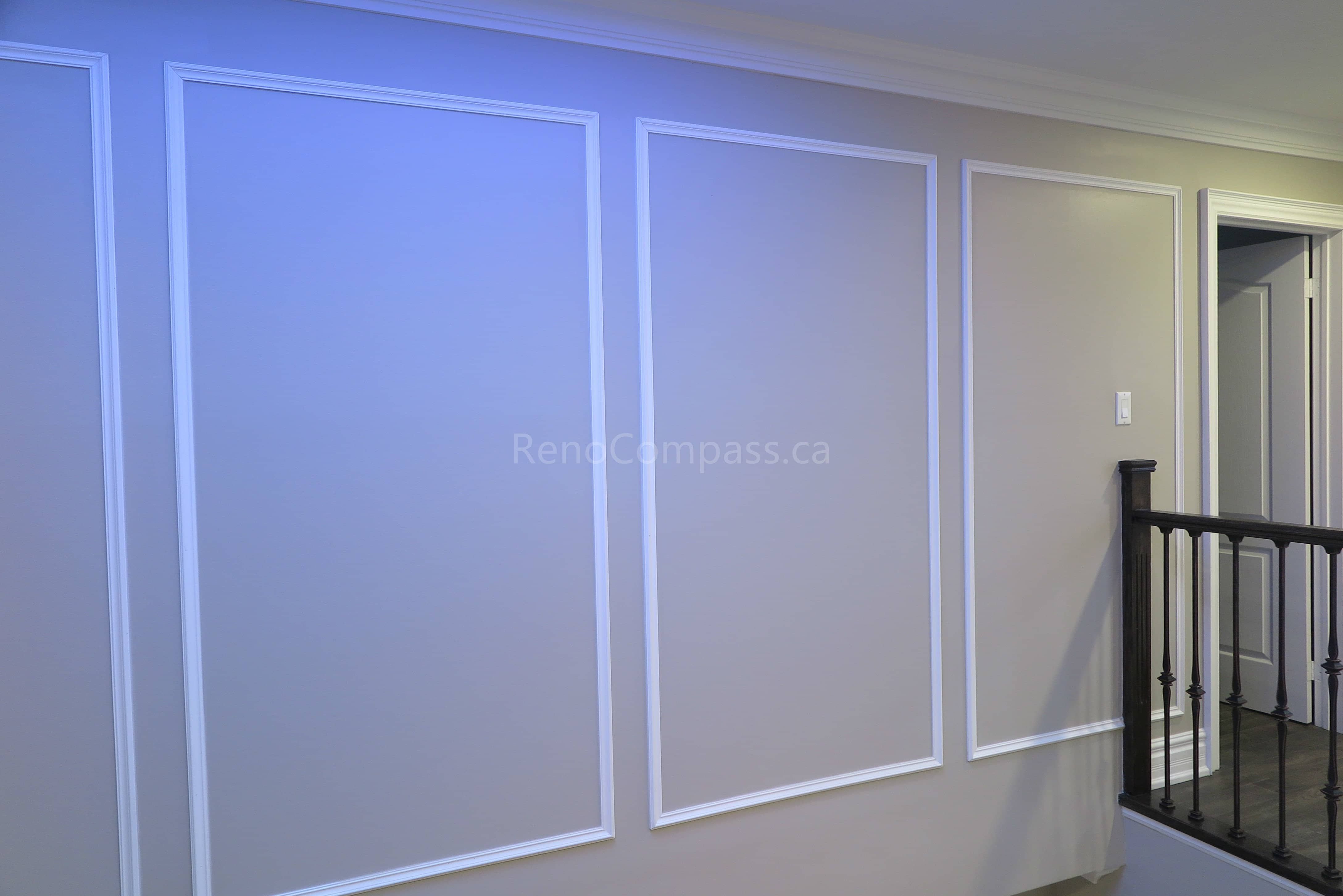 This Markham interior renovation features elegant custom wall panel molding that enhances the home's architectural detail and modern aesthetic. Clean trim lines, neutral wall tones, and quality finishing create a refined and sophisticated interior space that complements the staircase and upper hallway area. Completed by Reno Compass, a professional renovation contractor specializing in custom interior finishing and full home renovations across Markham and the Greater Toronto Area.