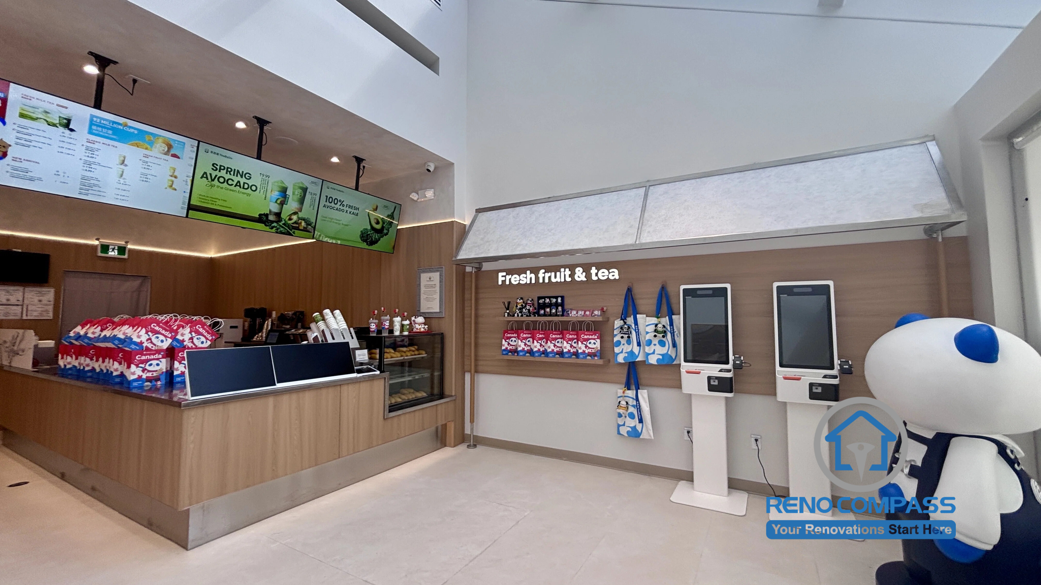 Commercial renovation project for TEABYDO in Richmond Hill featuring modern café-style interior design, illuminated menu displays, custom cashier counter, wood finishes, and clean customer-friendly layout. Completed by Reno Compass renovation team.